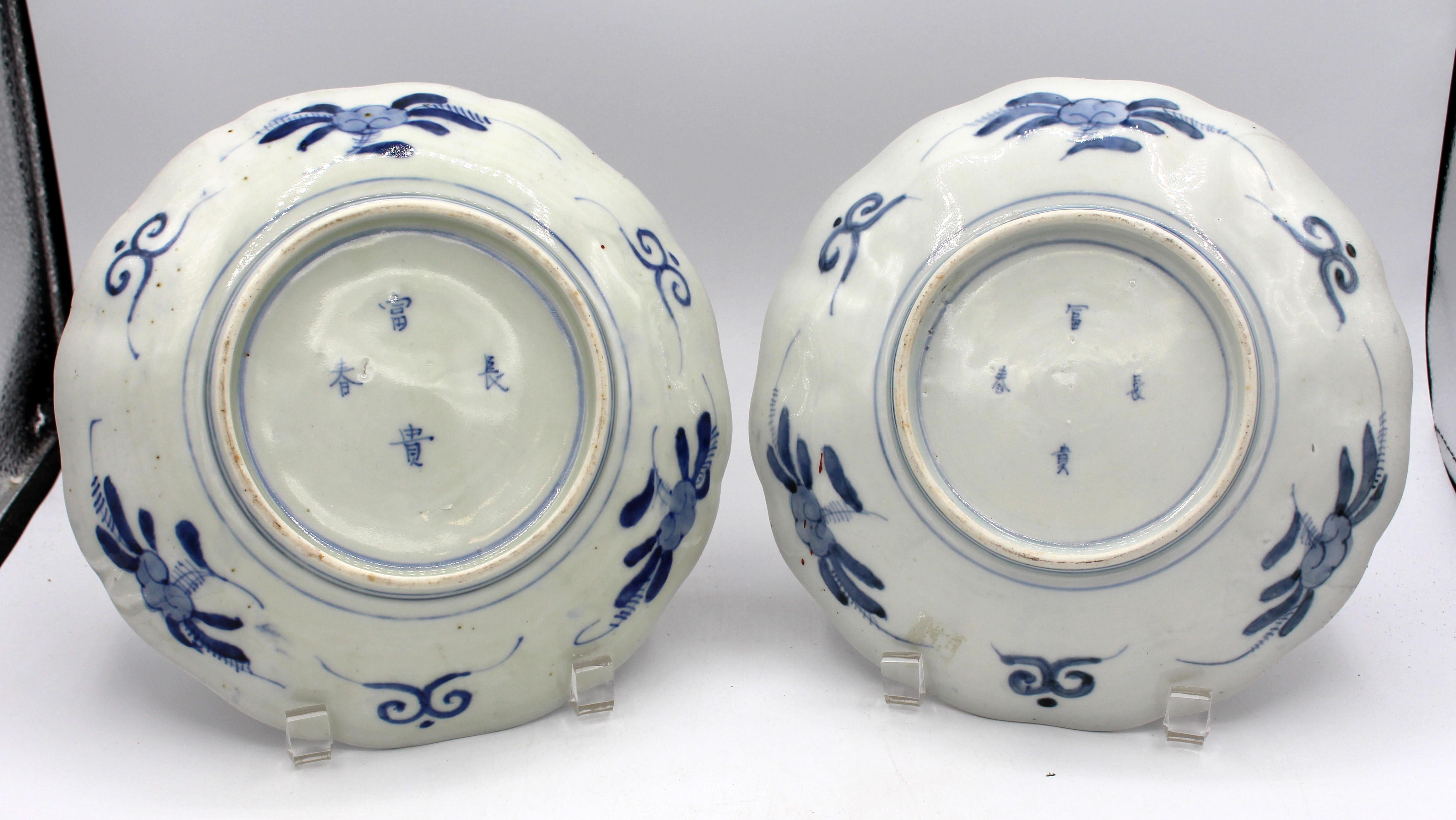 Circa 1860 Japanese Imari pair of plates. Scalloped edge; reserves representing Spring & Summer. Note the thistles. Superb colors. Nicely decorated en verso. 8 5/8