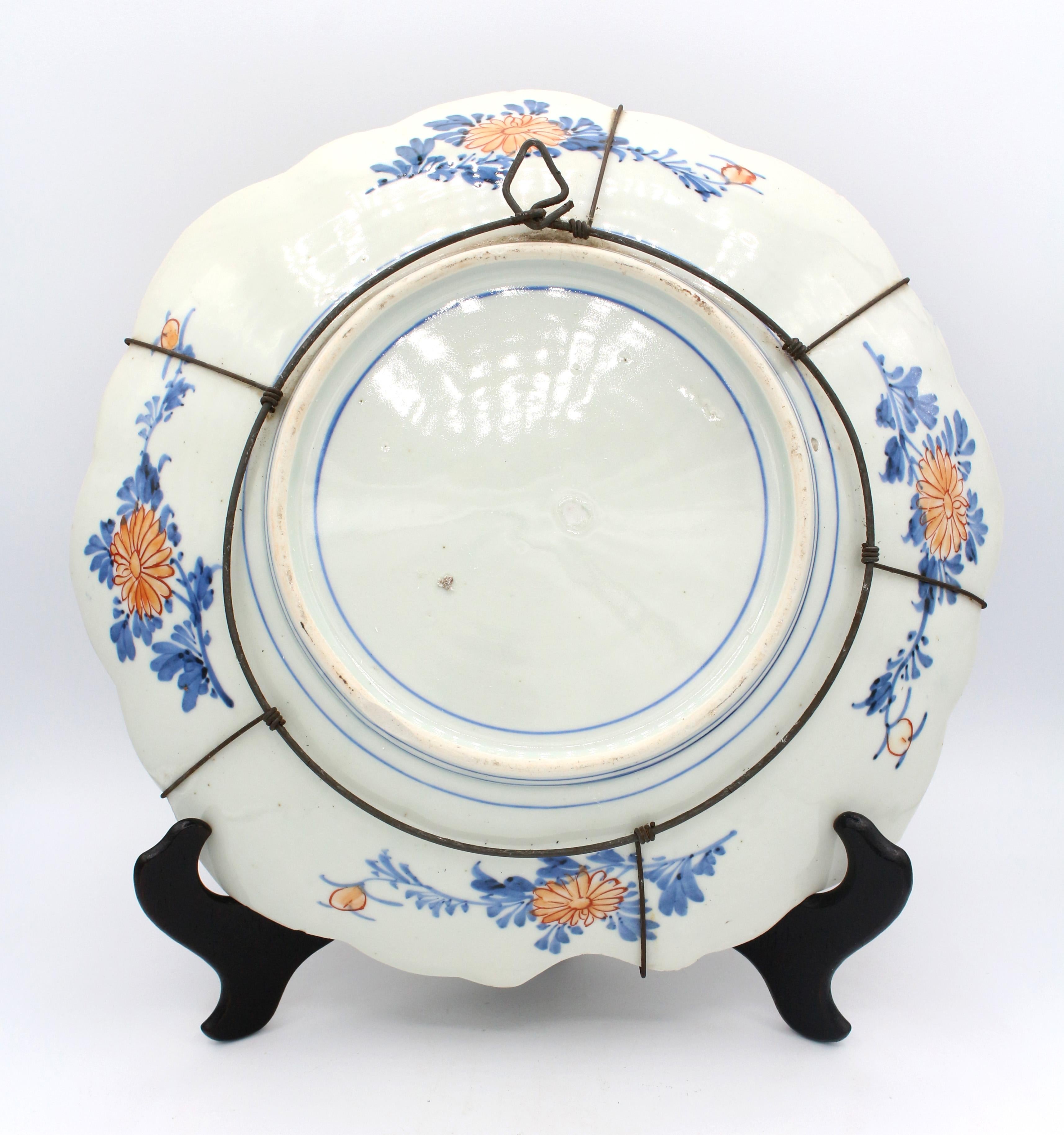 Circa 1860 lozenge shaped Imari Charger, central medallion with birds surrounded by alternating panels with an ancient tortoise & groups of cranes. The reverse well painted. Base rim chip; a few minute chips on reverse & one small reverse