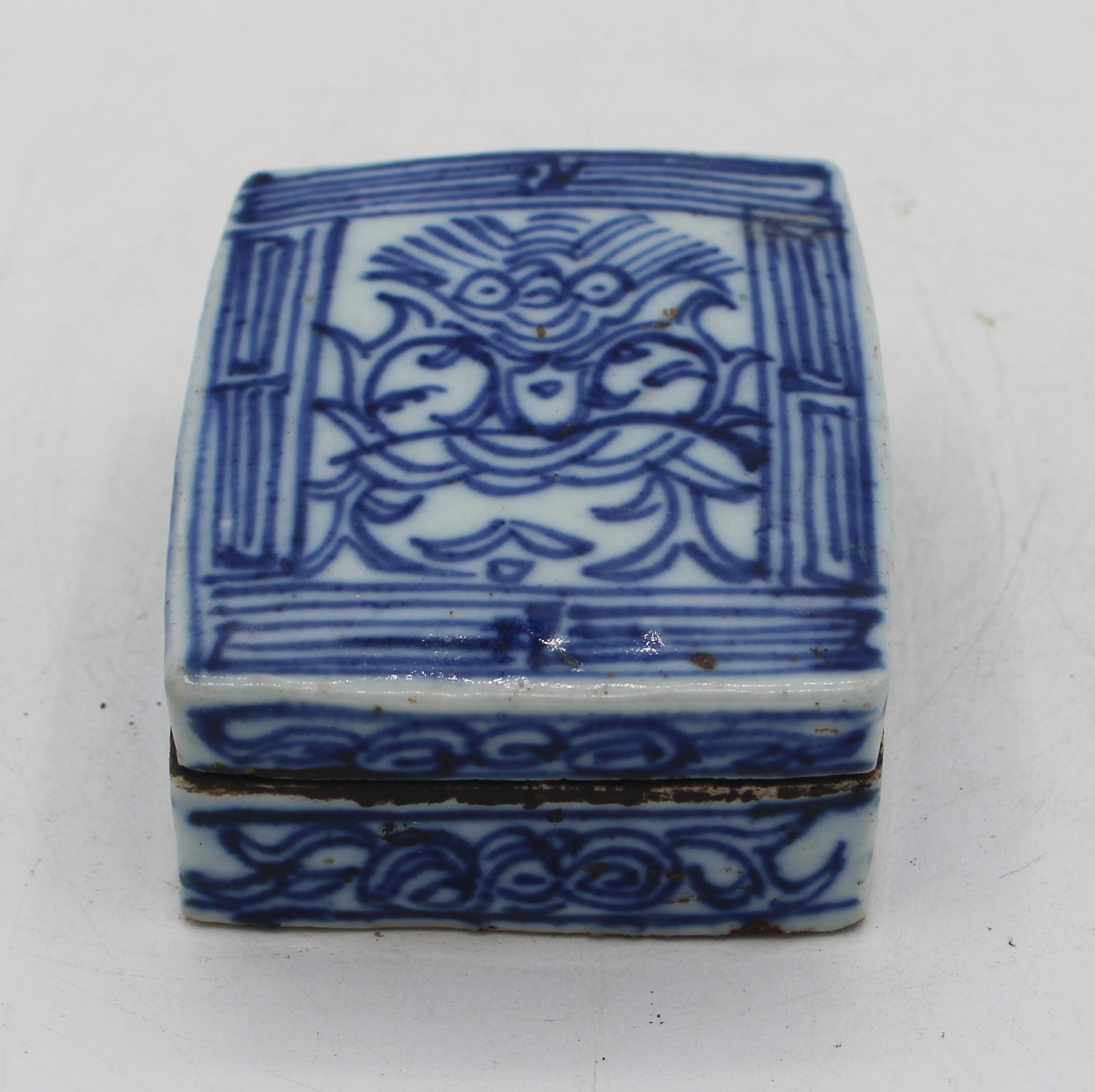 Circa 1860s Chinese blue & celadon double ink cake box. Porcelain. Qing Dynasty from the scholar's table. Decorated with flowing figure of a bat face & body stylized into tendrils. Traces of ink. 3 3/8