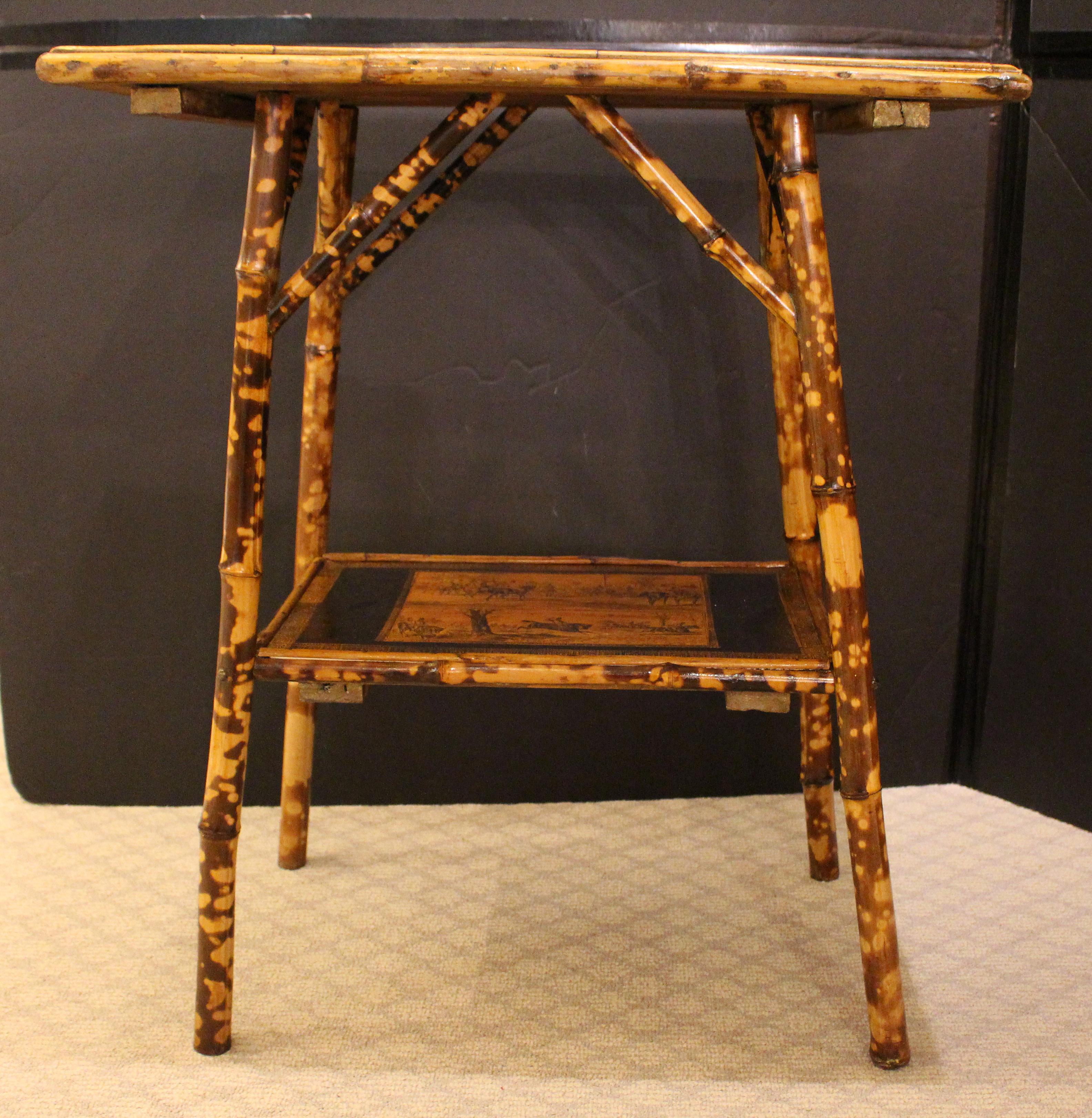 Circa 1870 English 2-tier rectangular bamboo side table. Grand proportions. Now decoupaged with horses on the upper tier and 2 hunt prints 