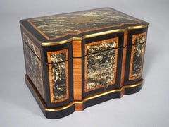 Umidificatore per sigari francese del 1870 circa con fronte a balestra ebanizzato e intarsio in ottone tagliato