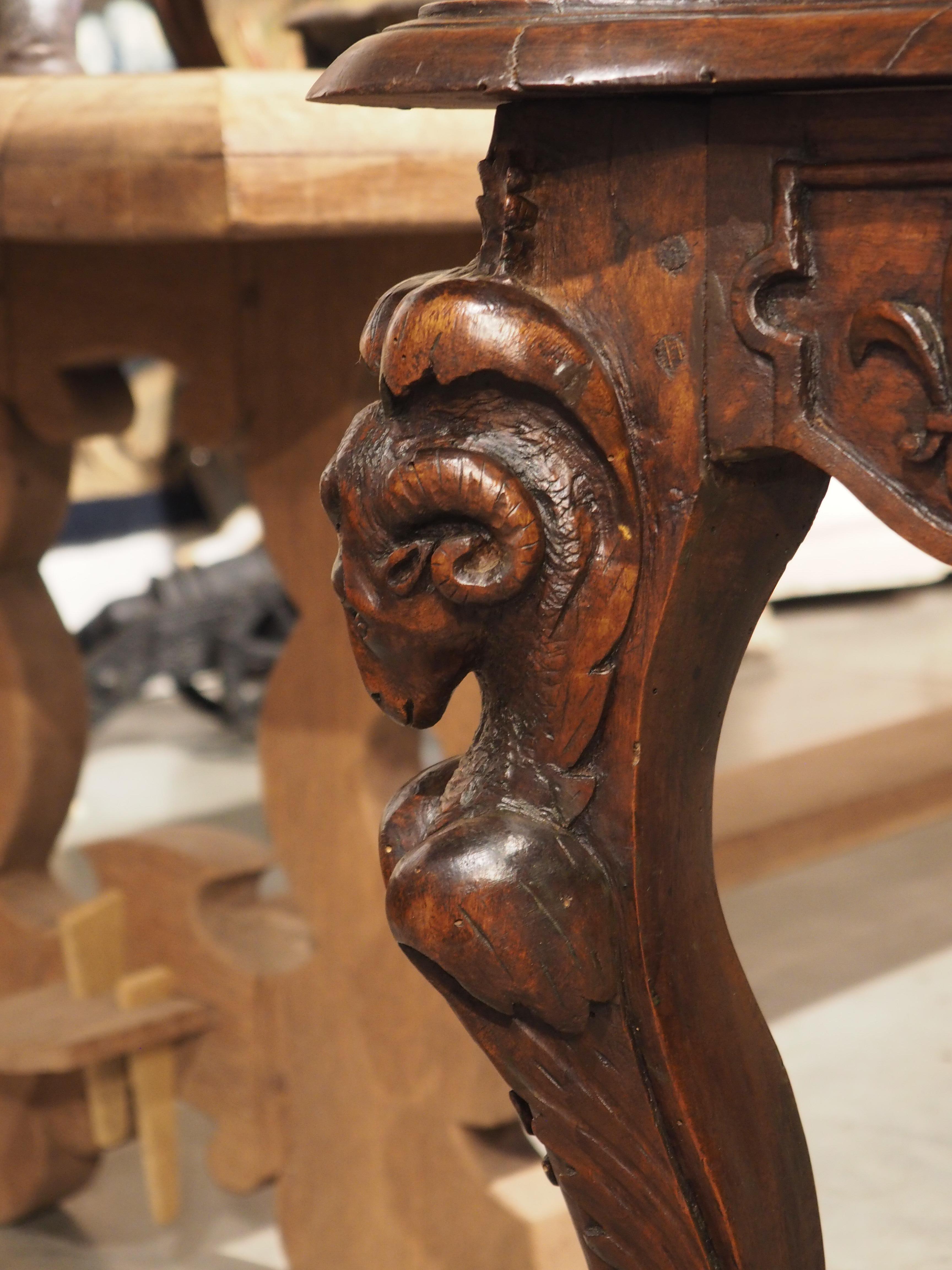 Hand-Carved Circa 1870 French Walnut Wood Center Table with Rams' Heads and Fleur De Lys For Sale