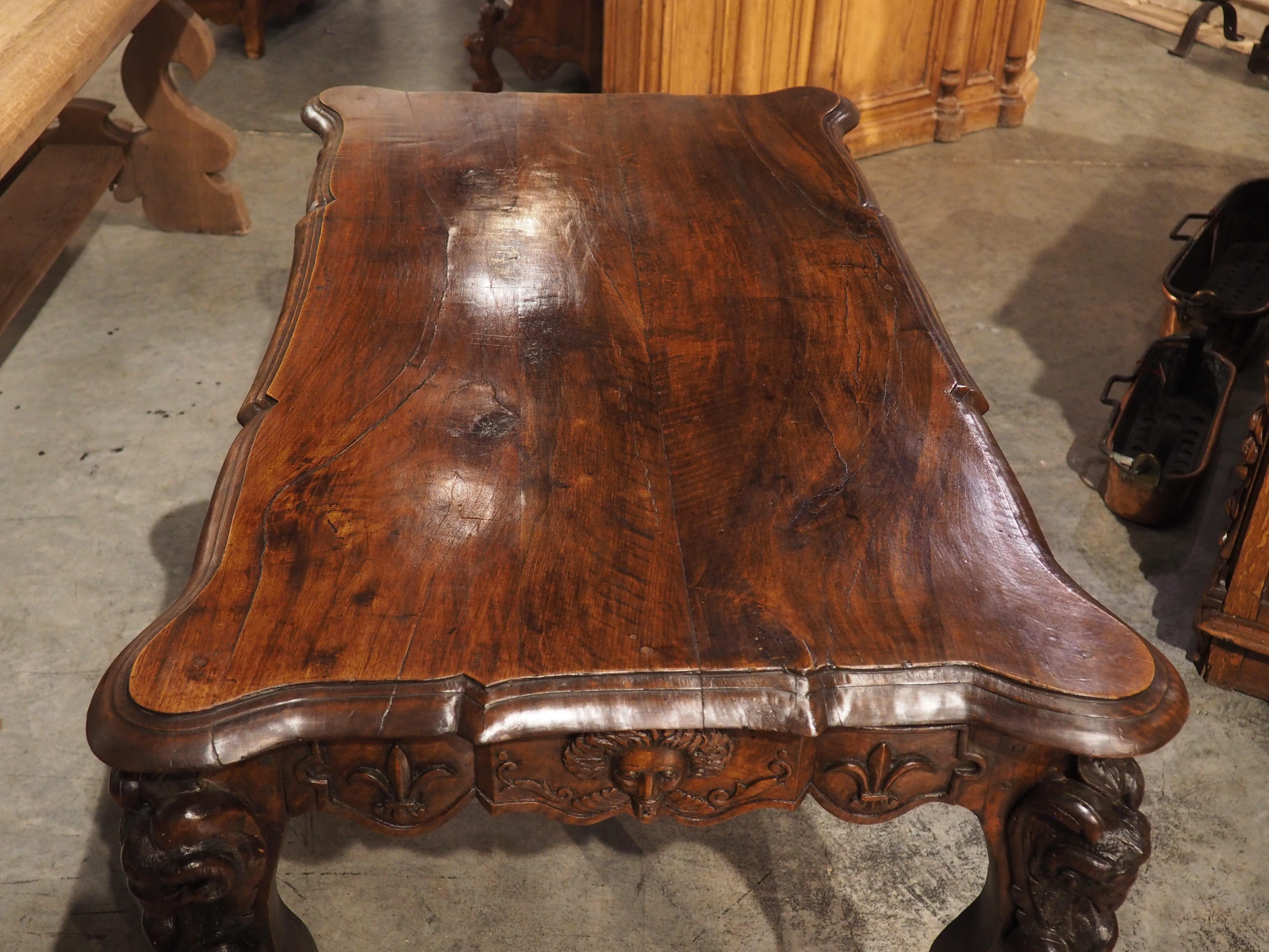 Circa 1870 French Walnut Wood Center Table with Rams' Heads and Fleur De Lys In Good Condition For Sale In Dallas, TX
