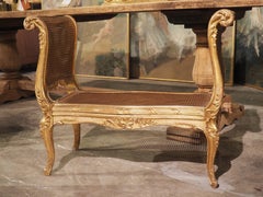 Circa 1870 Sculpted Louis XV Style Giltwood and Caned Banquette from France