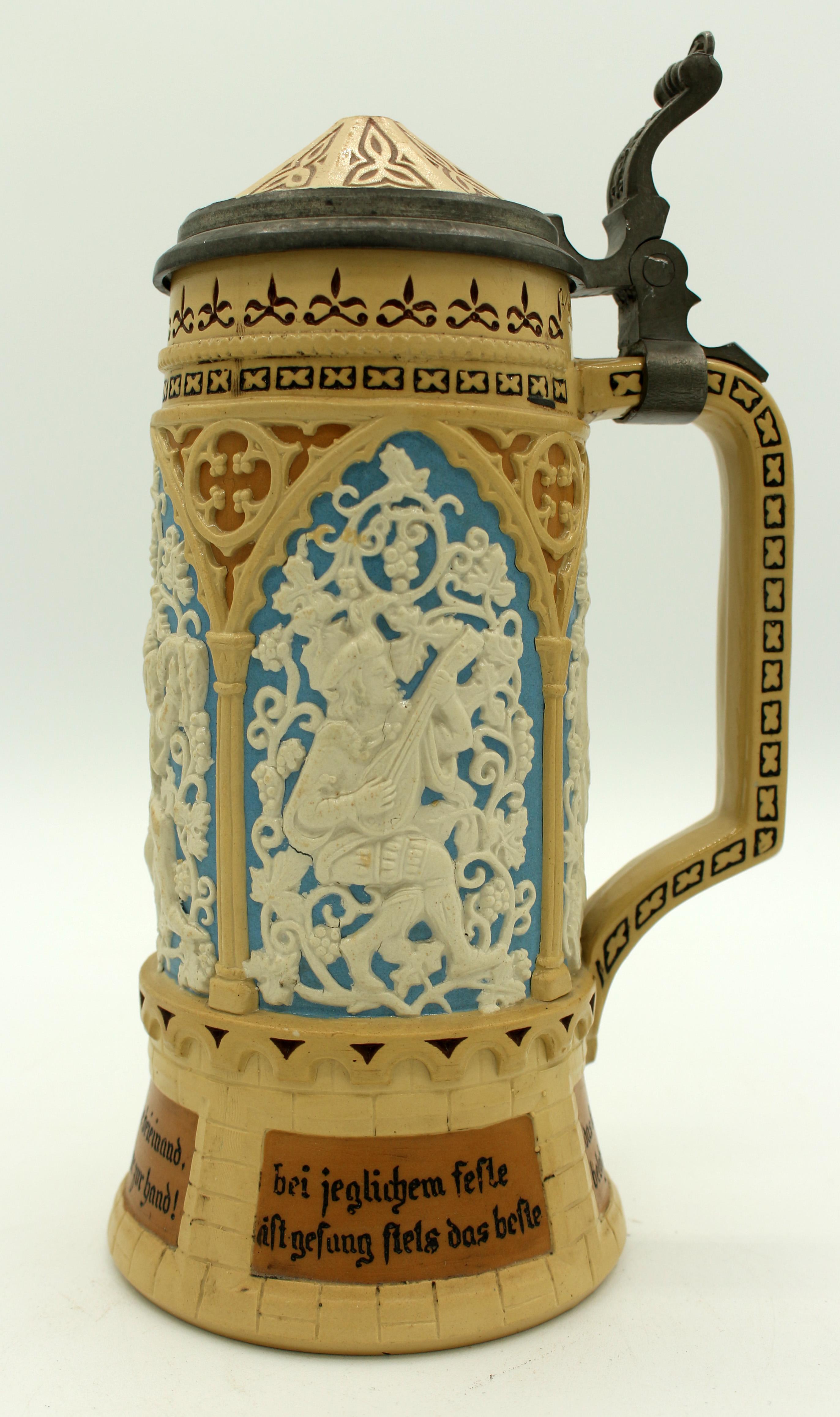 Antique c.1870 stoneware stein by Mettlach Villeroy & Boch. Green mark #228. Pewter flip cover in Gothic style. Each elaborate arch has drinking music & romantic scenes. Additional marks 93 & 20 impressed. Hairline above handle, inner rim nick is