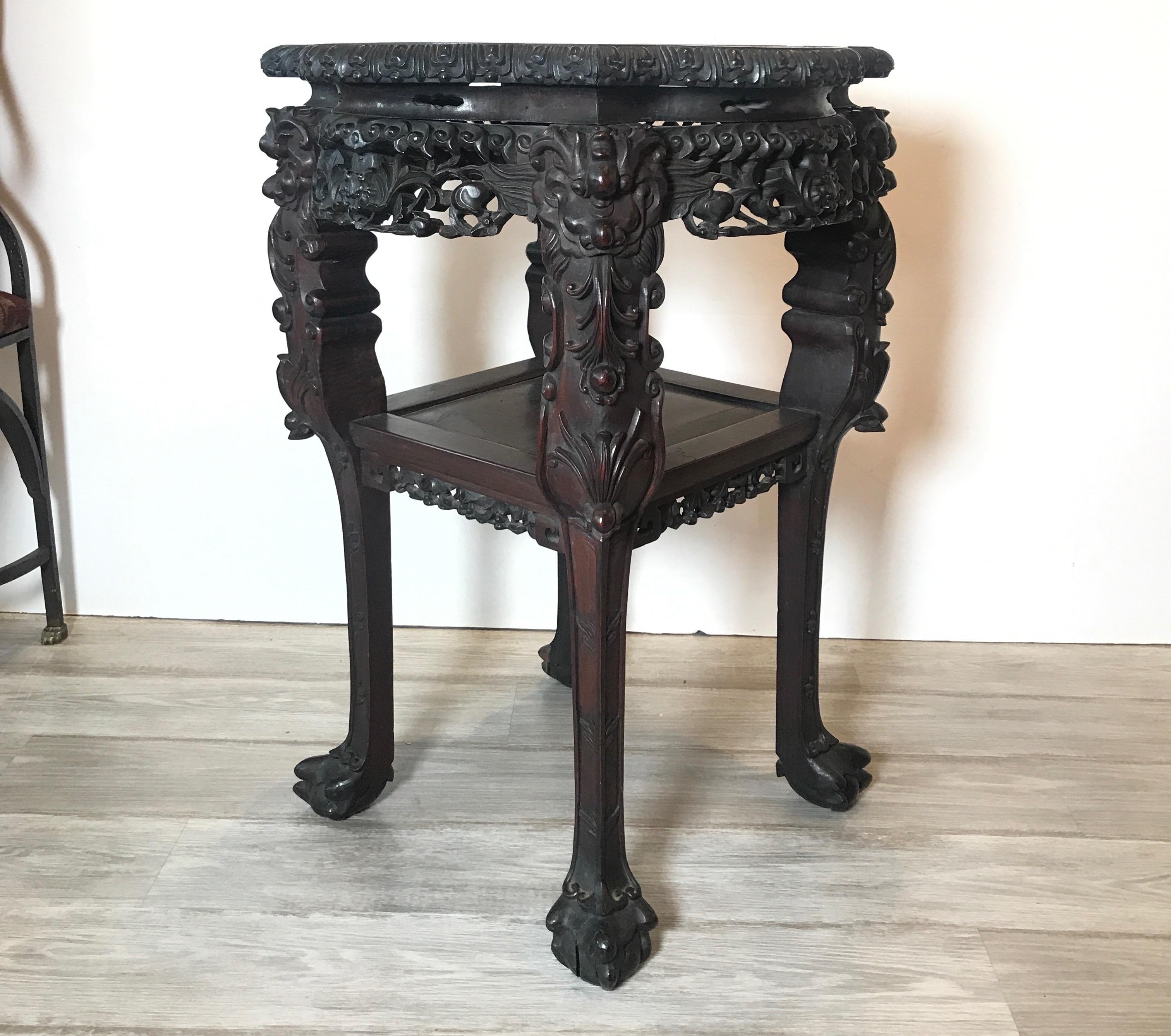 Rosewood heavily carved Chinese marble top two-tier stand, circa 1870s
Nice larger than usual size Chinese stand in very good condition.
Dimensions: 22
