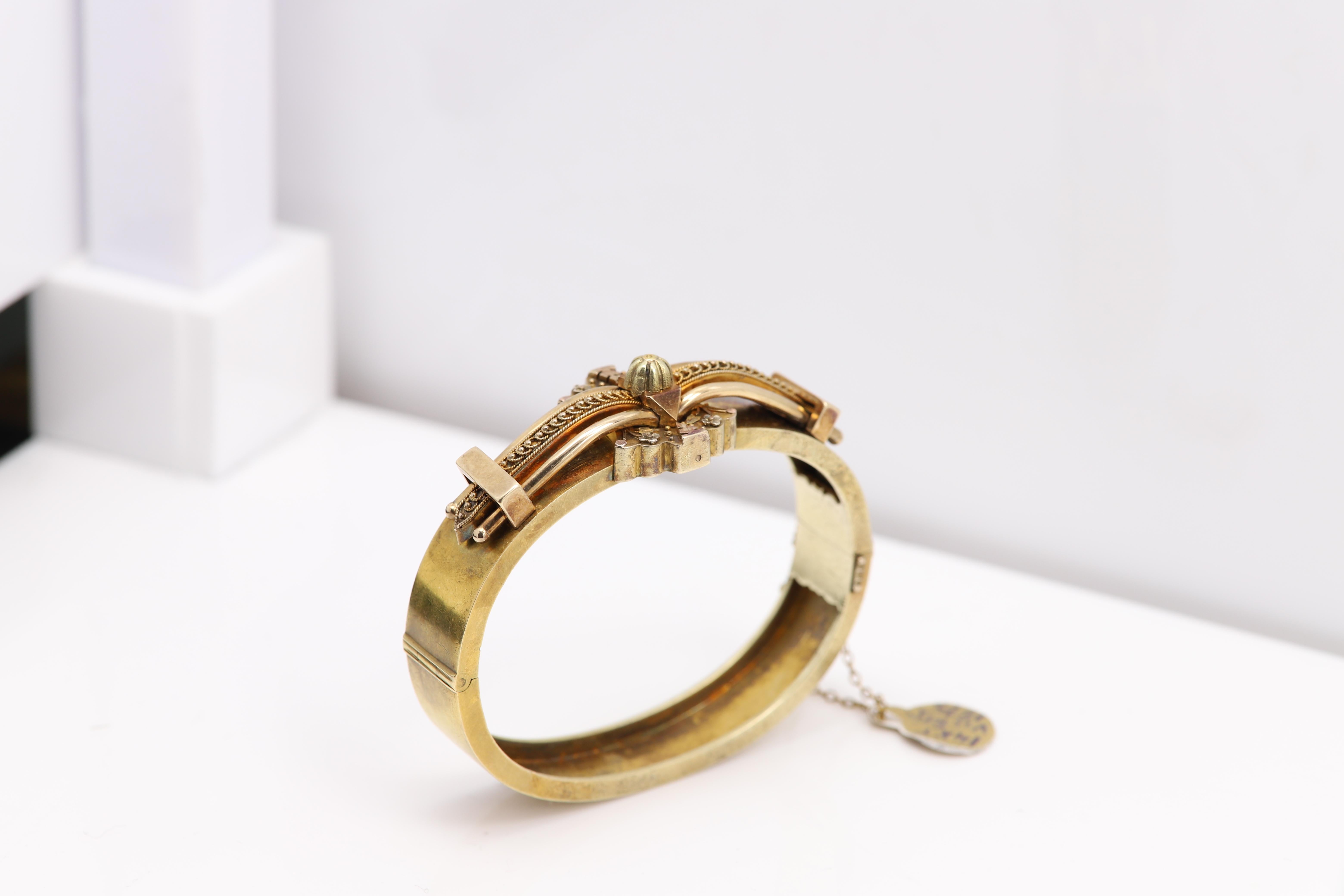 Old Victorian Bangle Bracelet Circa 1875
Total weight 29.30 grams
14k Yellow Gold
Diameter from inside 2.25' inch( 57mm)
Bangle width 12 mm
Bangle Size for the Wrist is approx 6.5 (circumference 6.5' inch)
Has a snap lock with extra chain