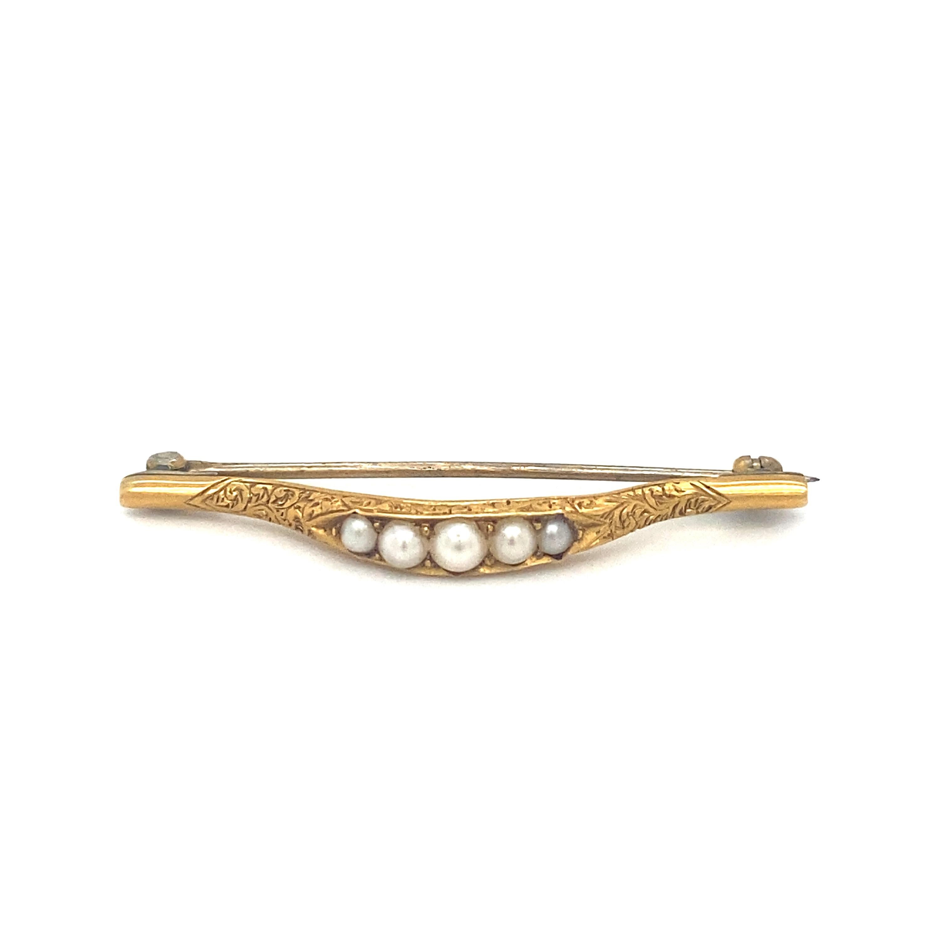 Item Details: This unique lingerie pin or brooch has an intricate repousse floral design with graduated seed pearls. This pin has an engraved date 