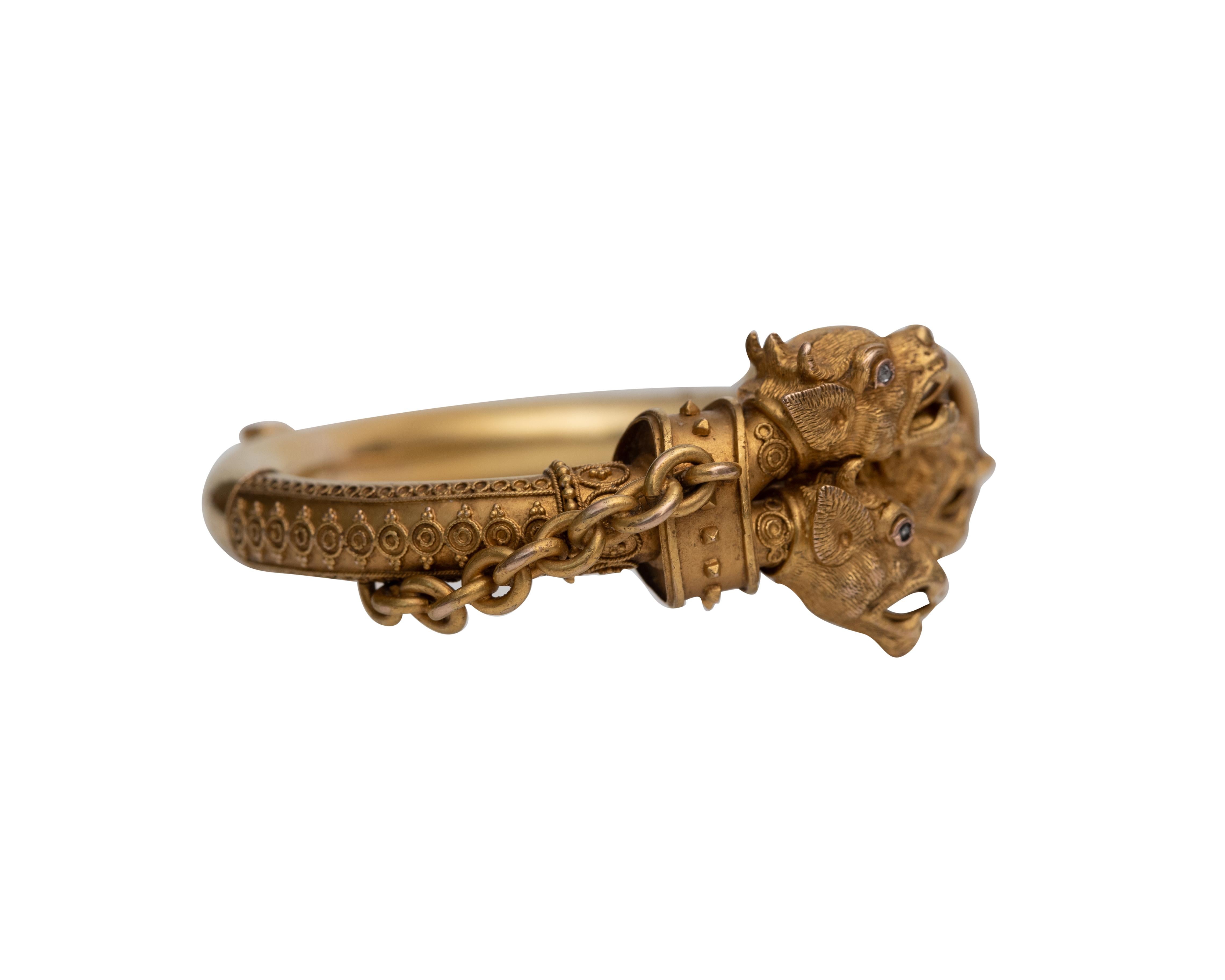 Description: 
Here we have a unique 1876 15K Yellow Gold Cerebrus head bangle. The Greek mythological being is known as the 