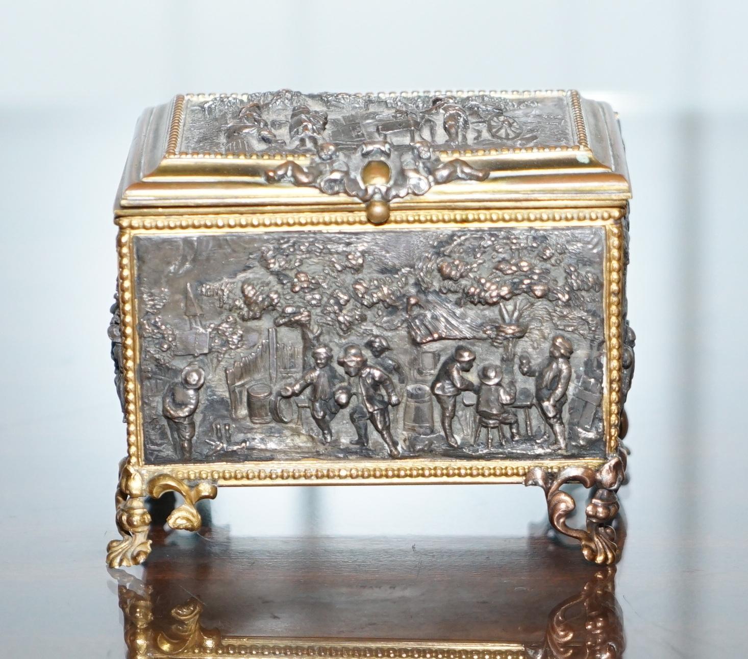 Wimbledon-Furniture

Wimbledon-Furniture is delighted to offer for sale this sublime AB Paris bronze Jewellery casket box with blue silk lining

A very well made and decorative trinket box, complete with the original blue silk lining. Every panel