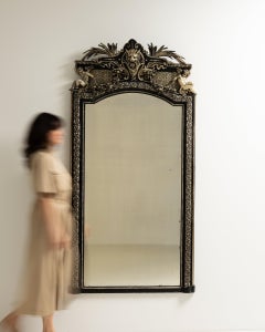 Circa 1880 Black Wood Napoleon III Ebonized Mirror with Ornate Crest