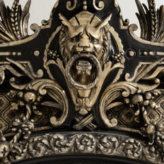 Circa 1880 Black Wood Napoleon III Ebonized Mirror with Ornate Crest