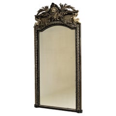 Circa 1880 Black Wood Napoleon III Ebonized Mirror with Ornate Crest