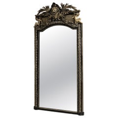 Circa 1880 Black Wood Napoleon III Ebonized Mirror with Ornate Crest