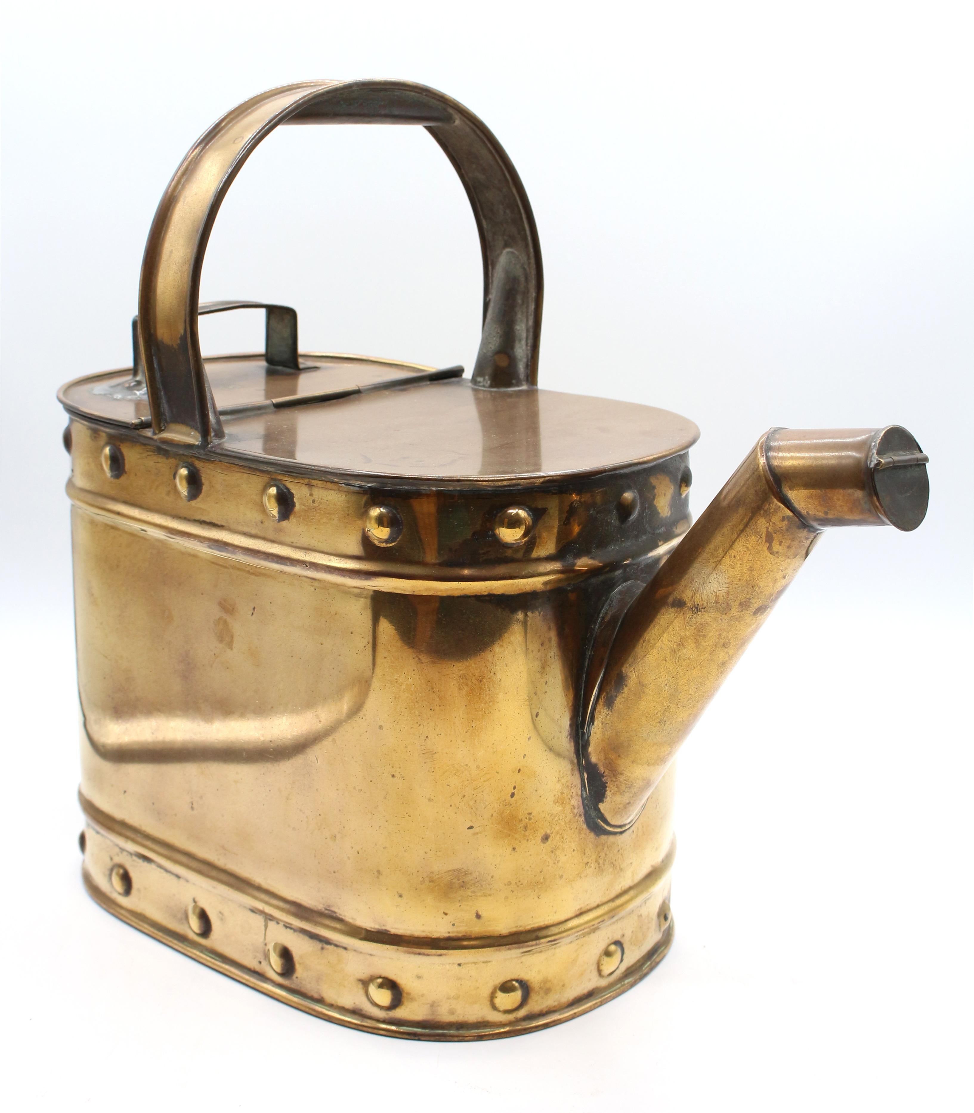Circa 1880 brass watering can. Shaped handle. Bosses top & bottom border decoration. Old lid handle repair. Chinese export, mark on lid handle. Spout flip lid. A fine example. One pin tip size hole now filled, it does hold water. 15.25