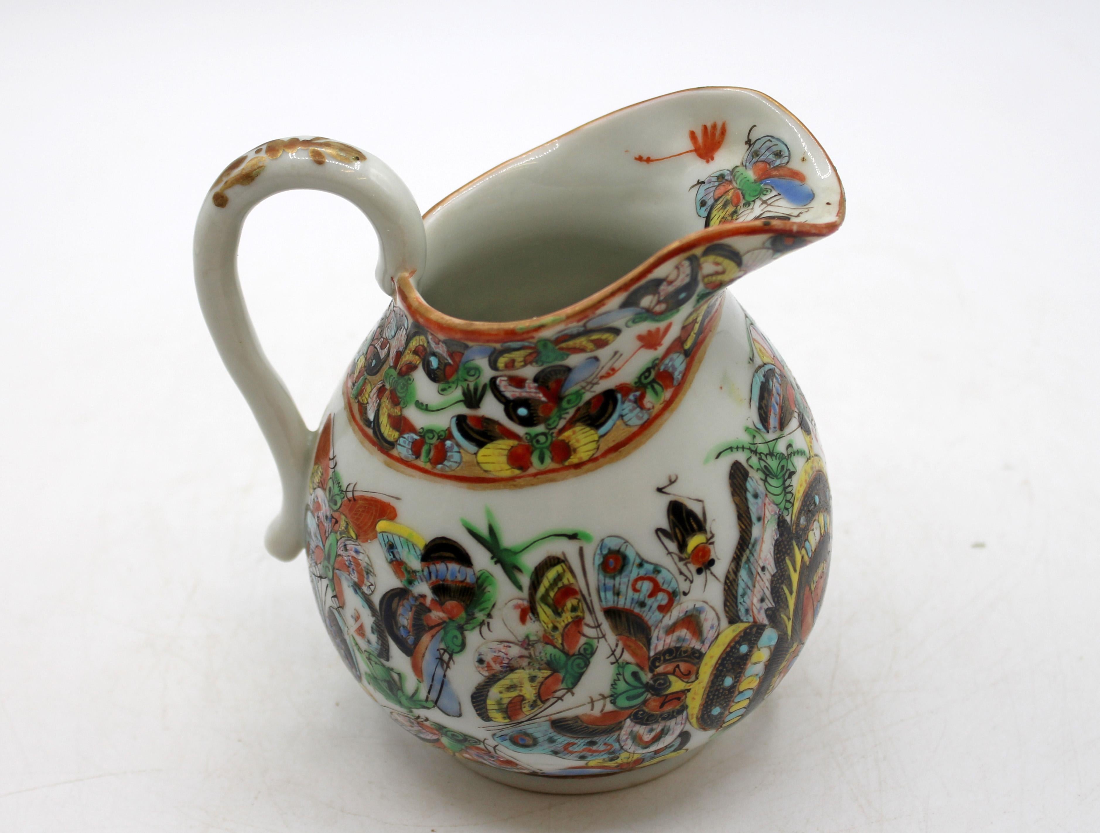Circa 1880 Chinese export porcelain thousand butterfly creamer. Scroll handle with gilding; finely enamelled decoration overall. Popular motif. Minor rubbing typical for age & use.
4.75