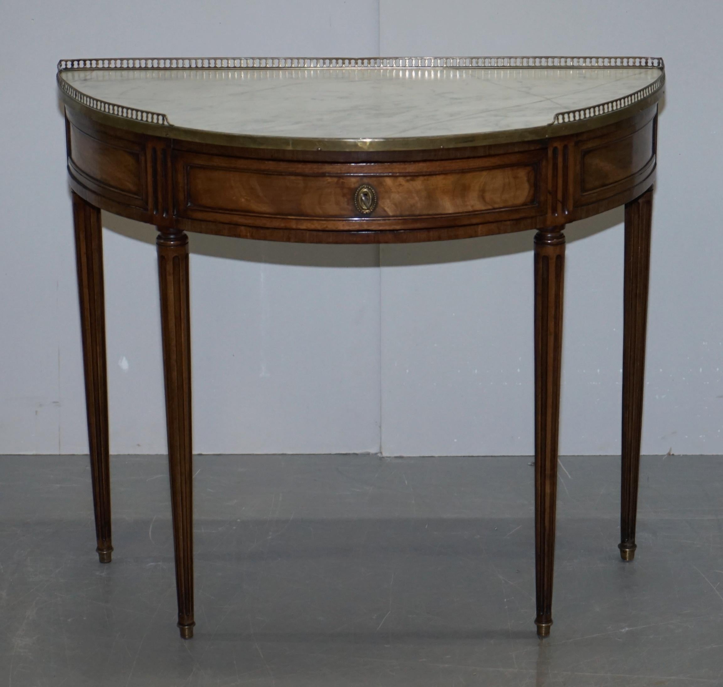 We are delighted to offer this lovely Victorian circa 1880 walnut demilune console table with original marble top surmounted by a brass gallery rail

A very decorative and well made mid Victorian period table. It’s a nice size, very much of medium