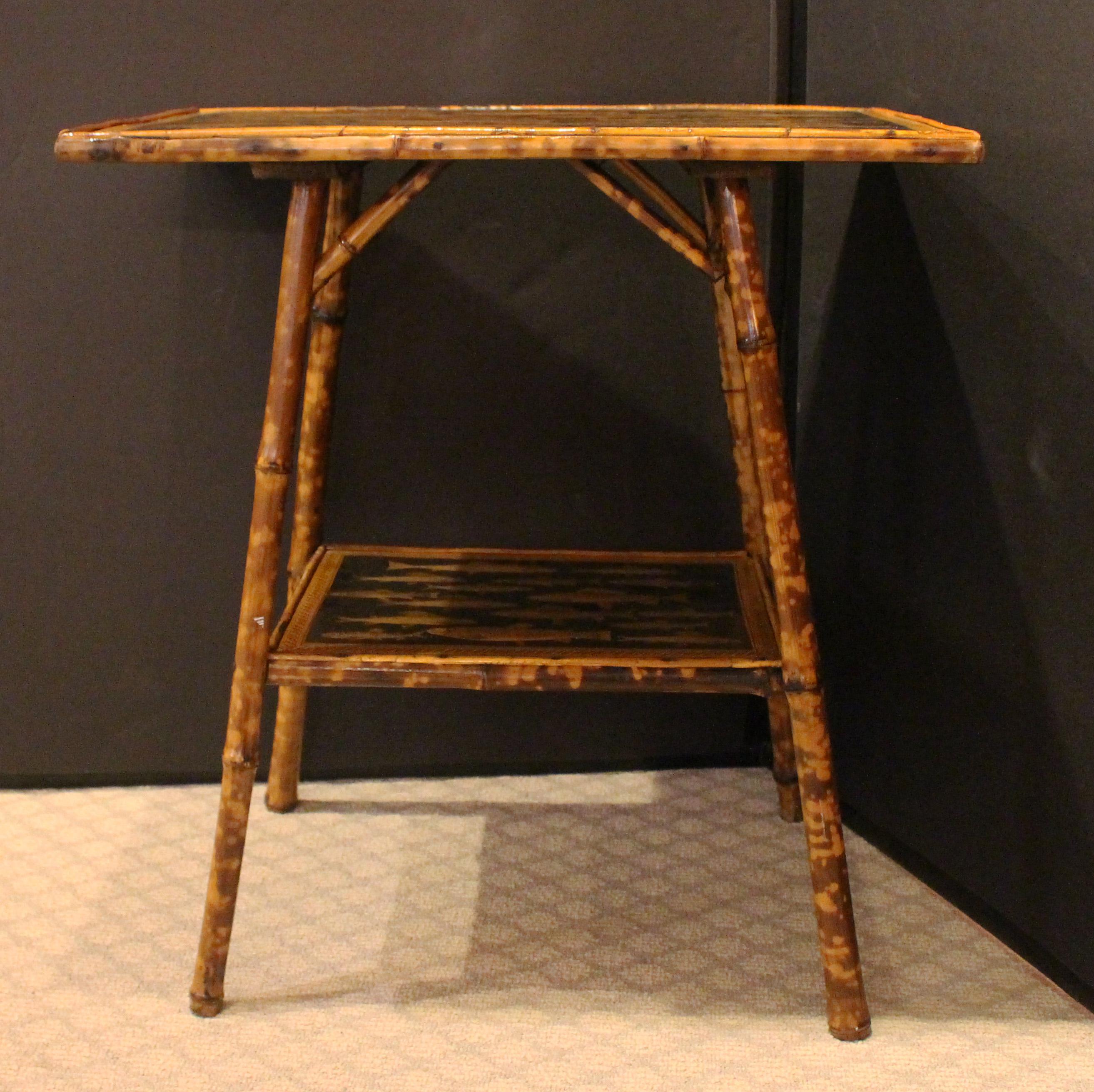 Circa 1880 English large size 2-tier rectangular bamboo side table. Now decoupaged with fish. Well figured bamboo.
23.25