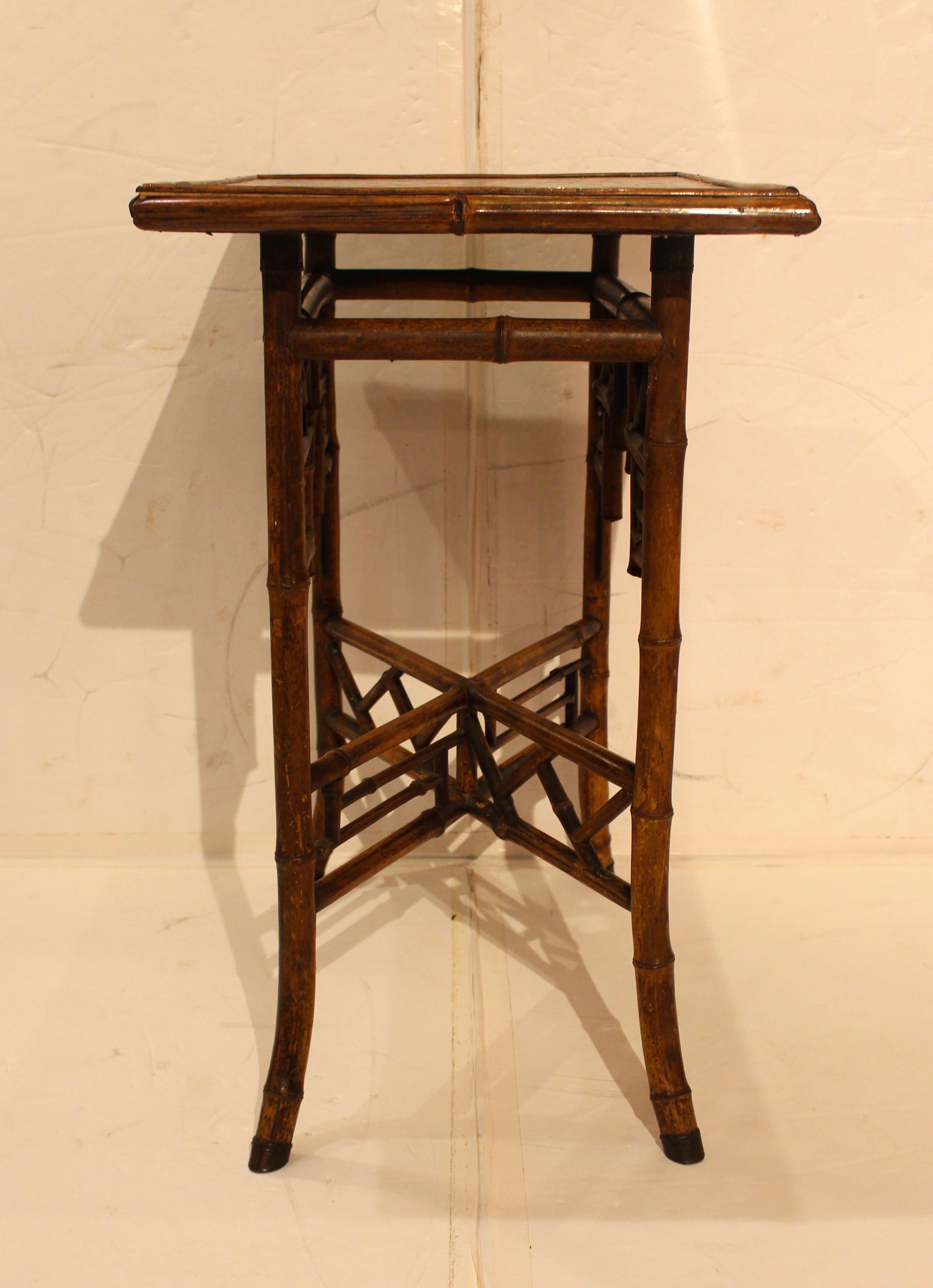 Circa 1880 large rectangular bamboo table decoupaged with butterflies, English. An exceptional example from each Needham's marked brass hoof foot sabot at the end of the splay legs to the Chinoiserie latticework along the aprons and robust