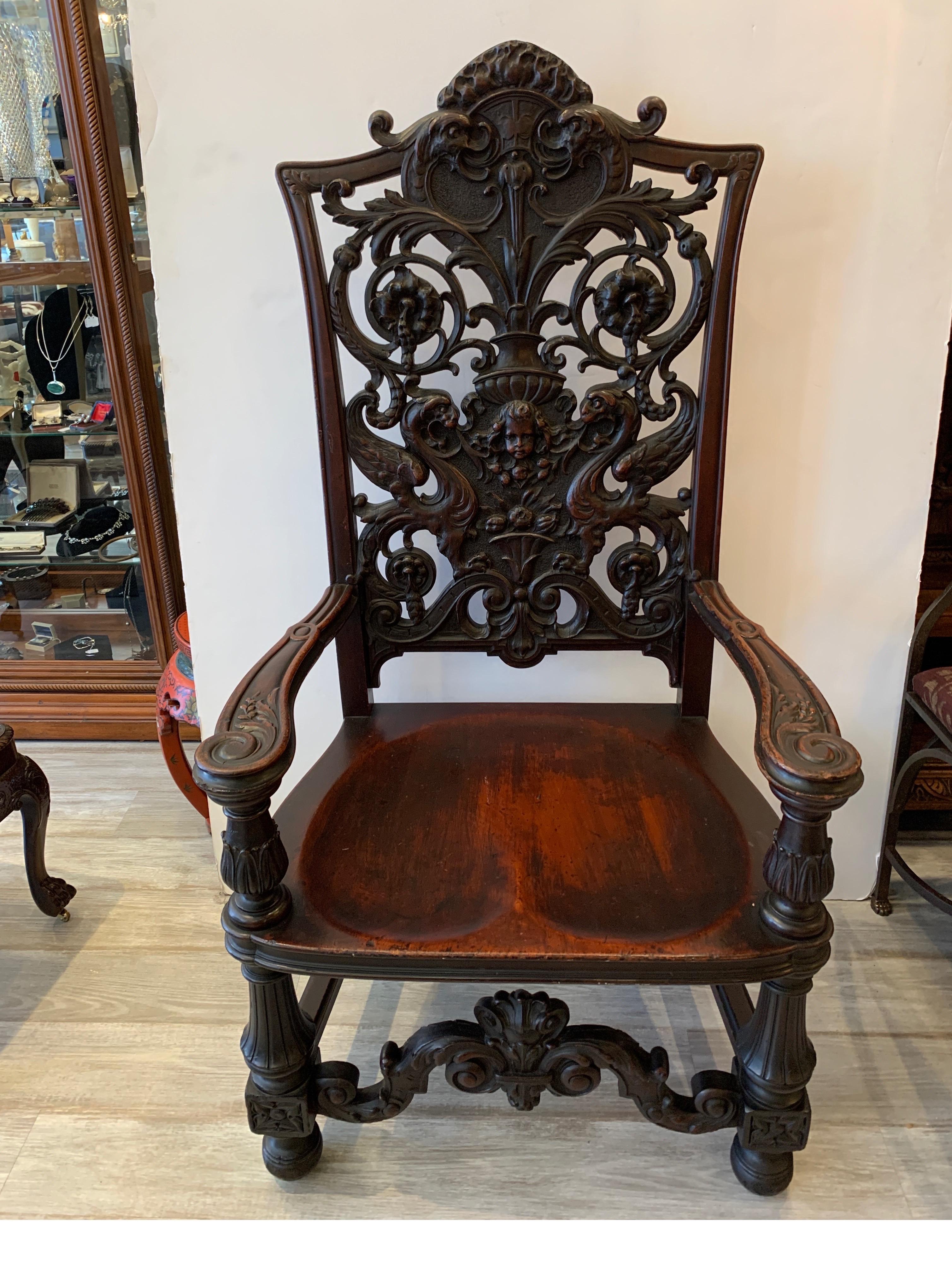 Exceptionally well carved mahogany chair with floral design, cherub and gargoyles beautifully carved and great patination to the wood finish, circa 1880. In the manner of Horner Brothers
Dimensions: 21