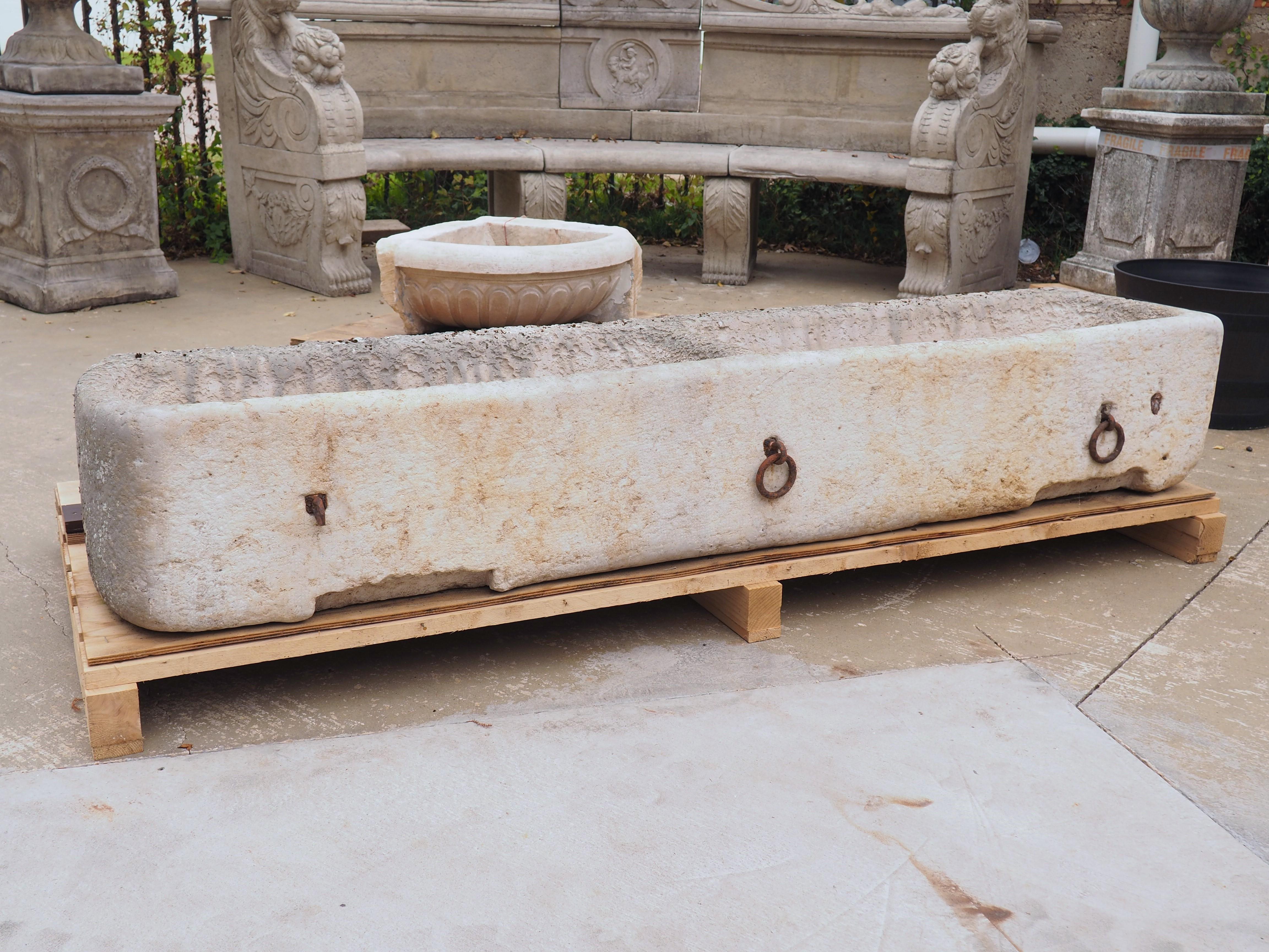 Hand-Carved Circa 1880 French Burgundy Stone Double Trough with Iron Horse Ties