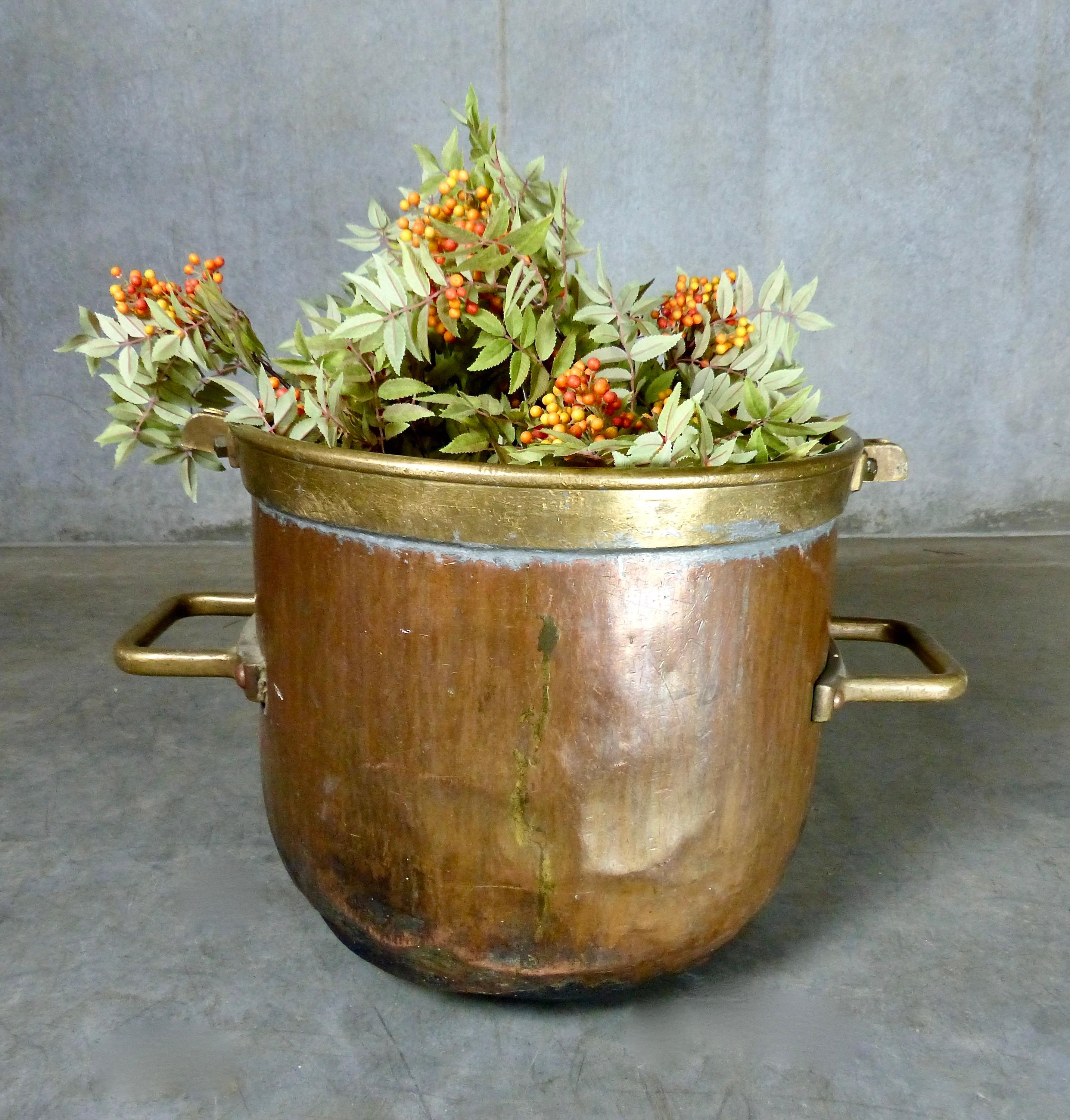 A larger sized, hand-hammered copper pot/cauldron from circa 1880s, France. Beautiful riveted brass handles and other decorative brass details. Use as a planter, log basket, whatever. A character accent piece.
Dimensions: 17” height x 19” diameter