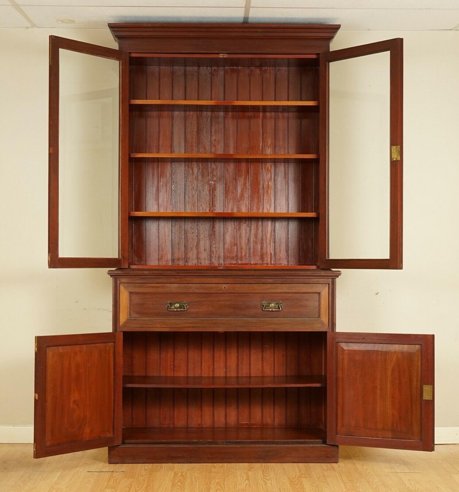 We are delighted to offer for sale this stunning circa 1880 hardwood library bookcase with a secretaries desk.

A well made and collectable library bookcase. The top section has three height-adjustable shelves so four sections in total. The middle