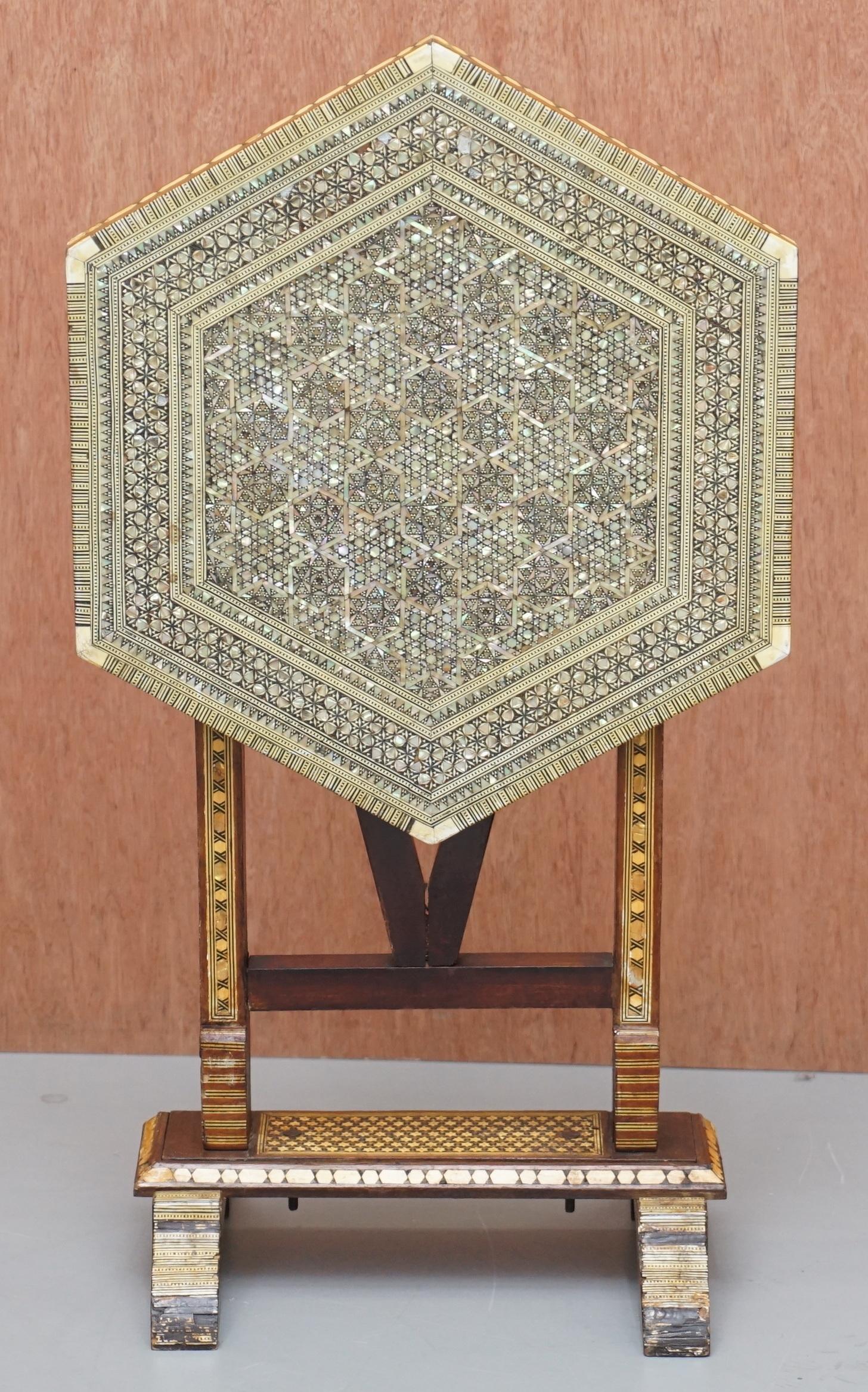 We are delighted to offer for sale this very rare circa 1880 Liberty’s of London retailed Moorish mother of pearl inlaid folding tea table

A very collectable table, I’ve never seen this size before with this type of folding mechanism and in this