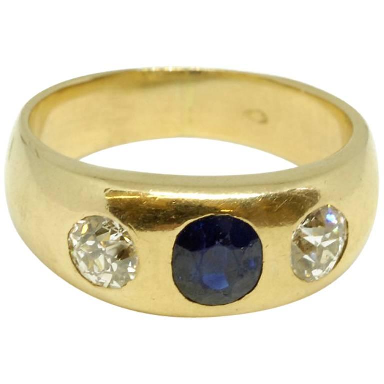 Circa 1880 Sapphire and Diamond 18 Karat Yellow Gold Three Stone Gypsy Ring