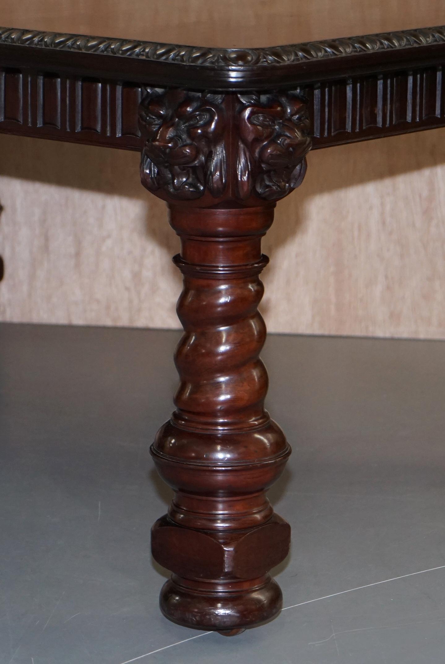 We are delighted to offer for sale this very large and substantial solid mahogany extending dining table with spiral legs topped with Lions heads

This table is solid! Really really solid, the legs are each one piece of hardened mahogany, carved