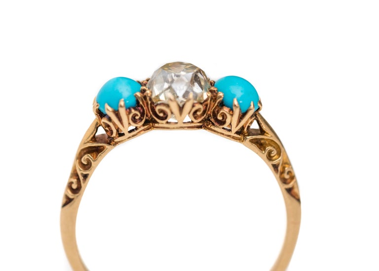 This blue-eyed beauty is sure to take your breath away! Dreamy turquoise and an amazing 1.2 carat old mine cut diamond nest perfectly into this Victorian ring to create a truly unique piece.

This Victorian era diamond engagement ring features an