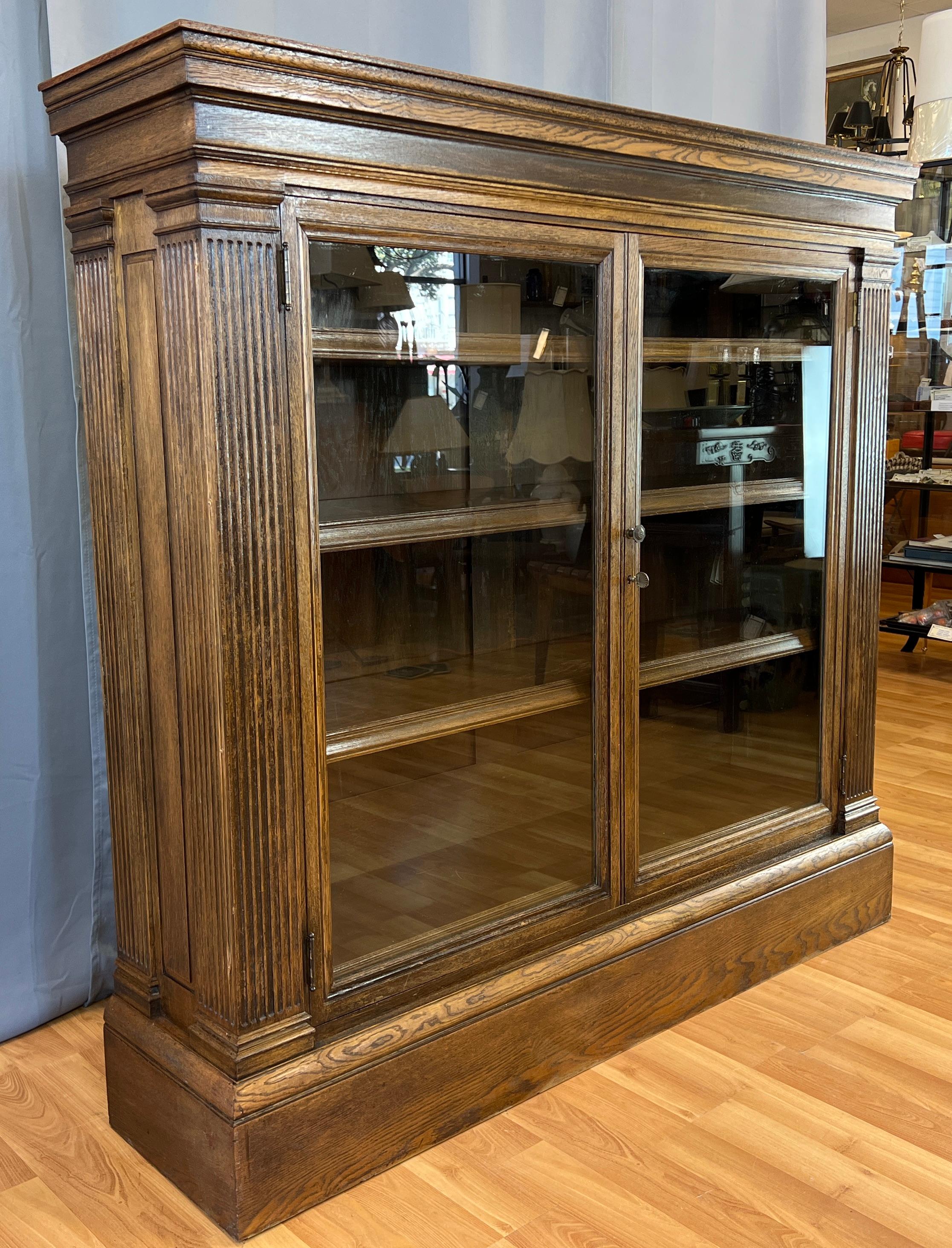 A wonderful circa 1880s double door lawyer's bookcase, we believe the wood is Walnut.
Has it's original glass panes, and key to the door on the right, left door has an inside latch.
Four adjustable shelves, with detailed edges. Shelves are about 9