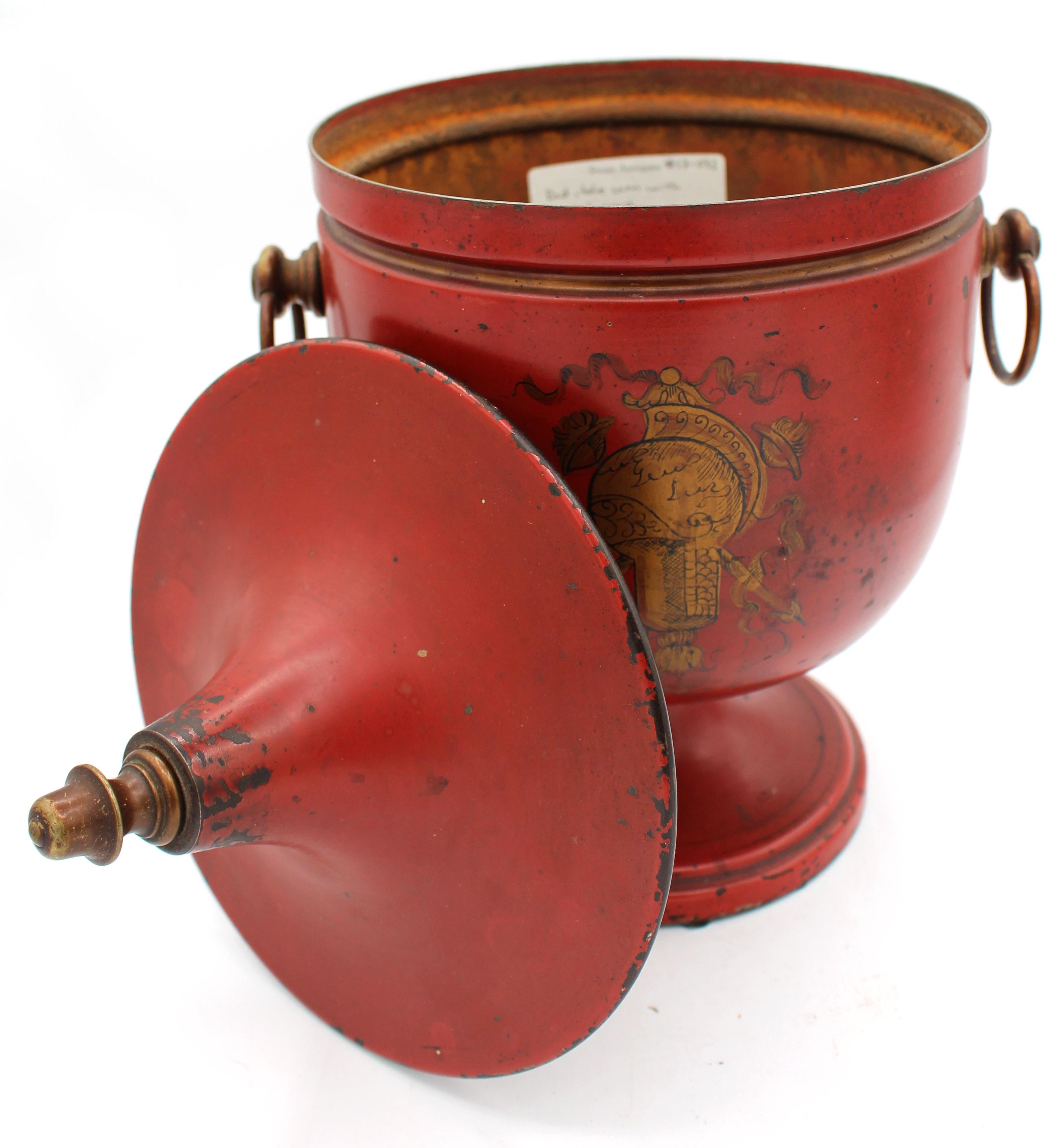 Circa 1880s French scarlet & gilt tole covered urn. Handsome Classical form with trophy decoration. Bronze finished brass fittings. Provenance: Georgia collection from Swan Antiques, Atlanta, GA (label inside priced at $1,175). Overall wear