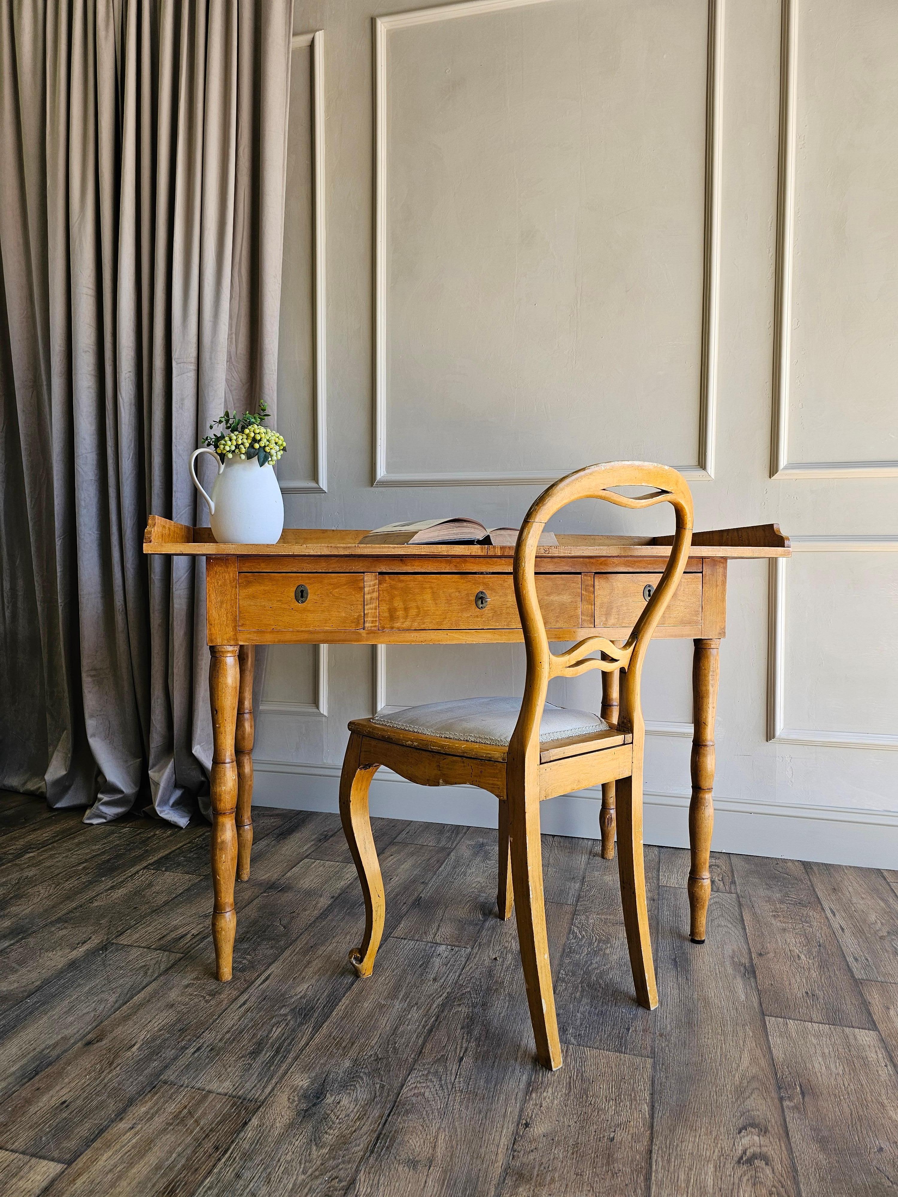 An exquisite 19th-century Swedish writing desk and matching balloon back chair, dated 1888, in the style of its Gustavian heritage. Featuring beautifully aged flame birch with a warm, rich patina that has developed over more than a century of use.