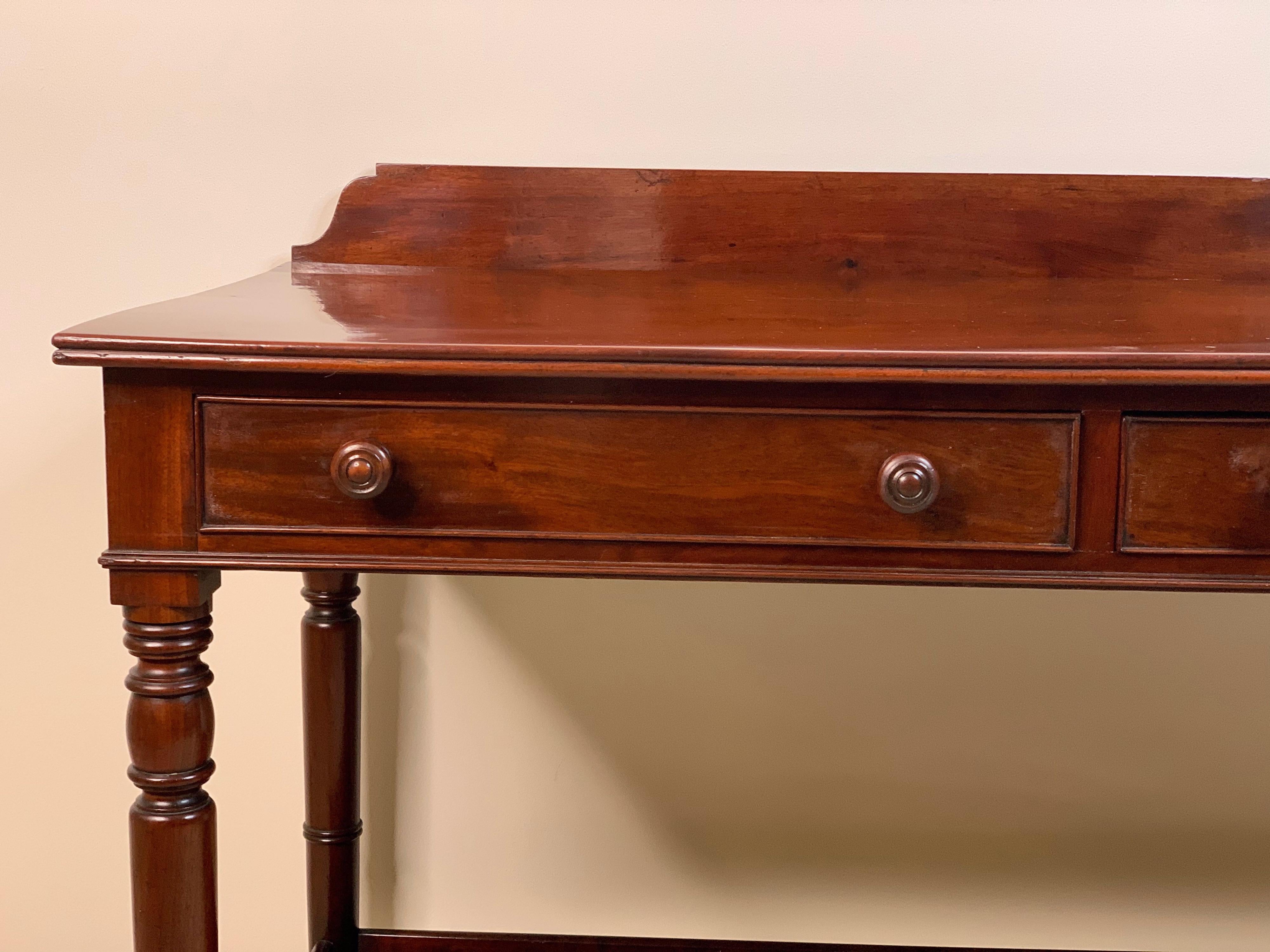 English mahogany two-drawer server or dressing table, can be used as a server or as a vanity/dressing table made of beautiful english mahogany wood, circa 1890-1900
Dimensions: 26.75