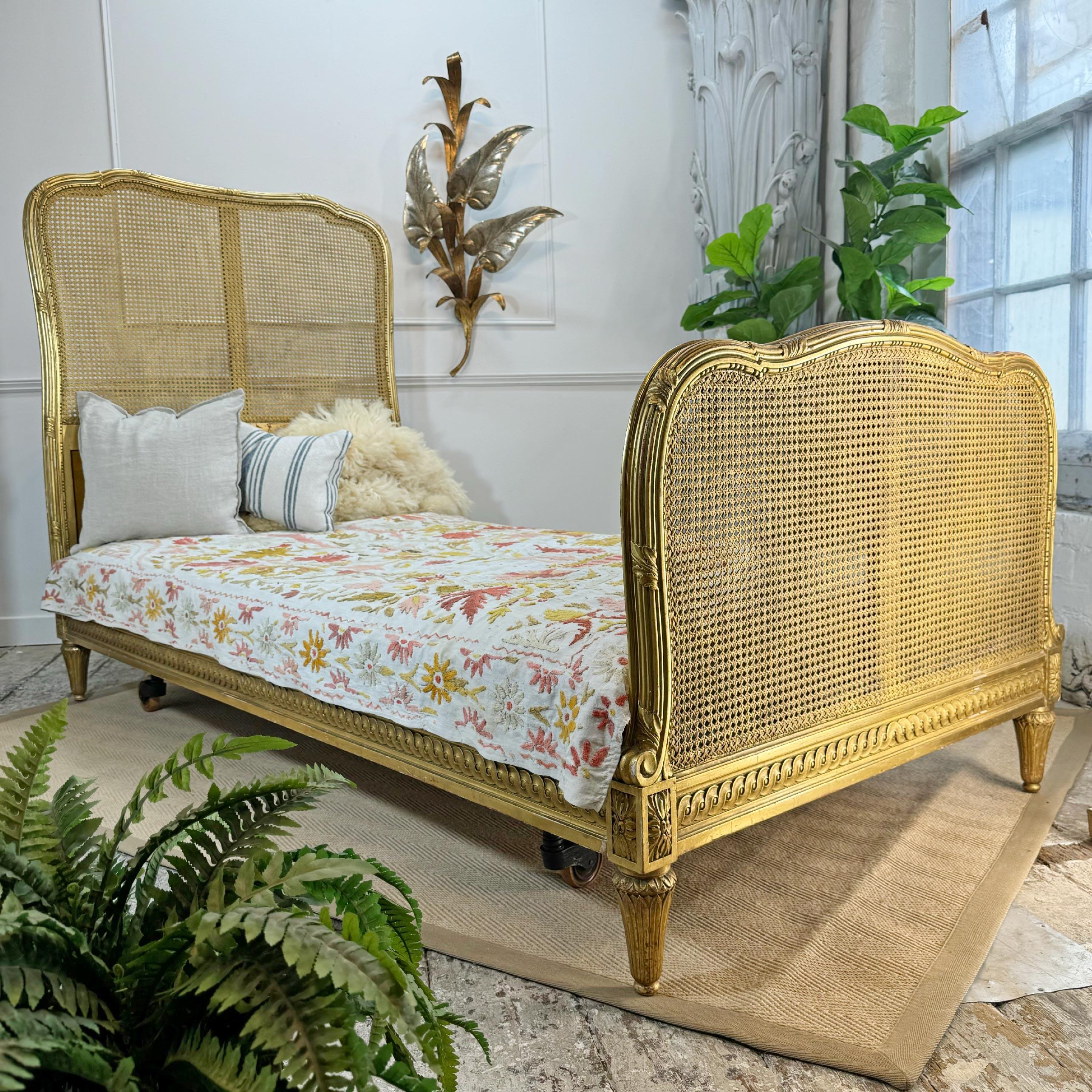 A stunning giltwood bergere cane bed by Maple and Co of London England, dates to circa 1900, the giltwood is bright and the cane work is perfect. The footboard is double caned, original mattress is present with the bed, but could do with a clean and