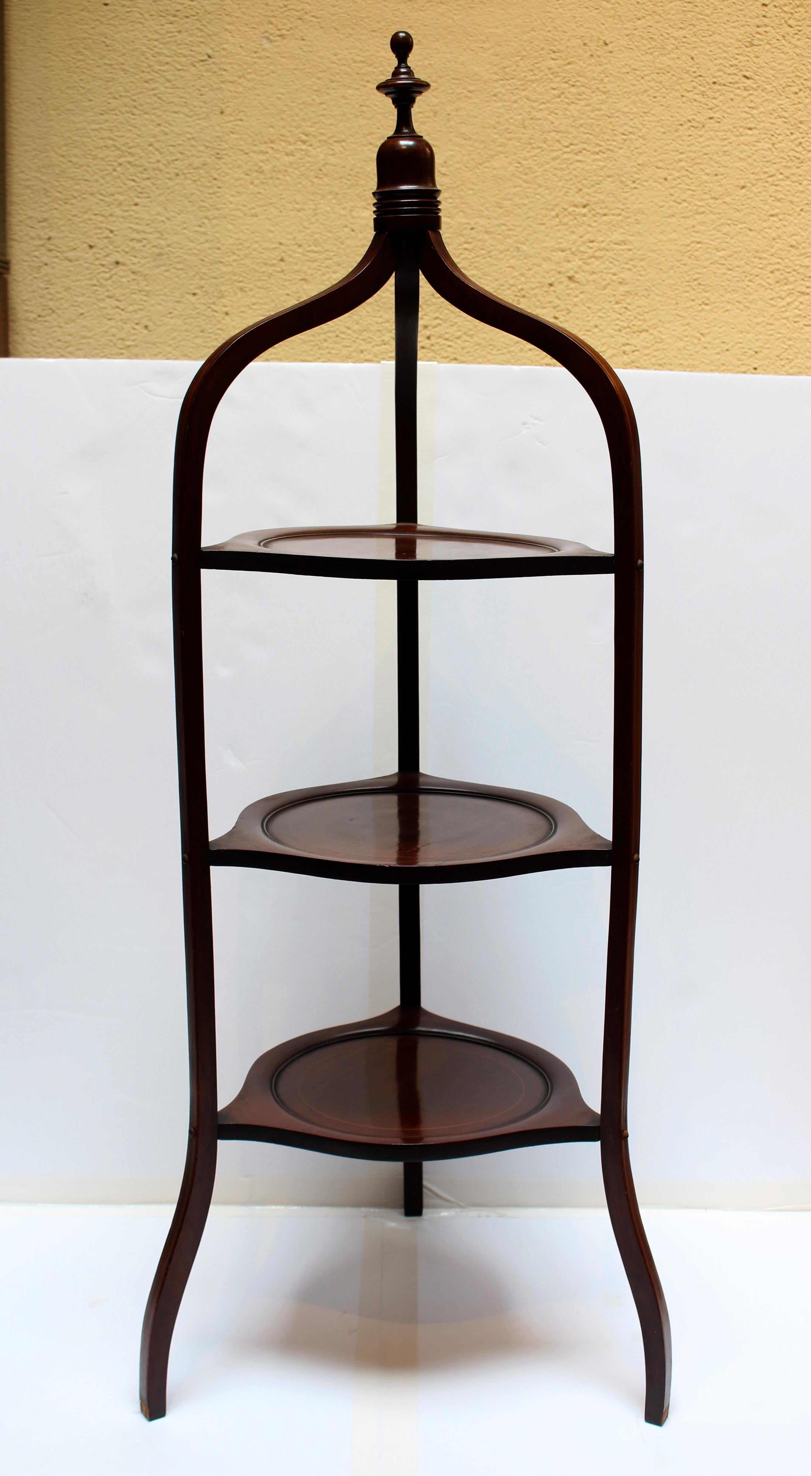 Circa 1890 muffin stand, English, neoclassical style. Mahogany with boxwood circle inlaid molded surfaces & boxwood stringing on uprights. 3-tiers. Finial top. 15.5