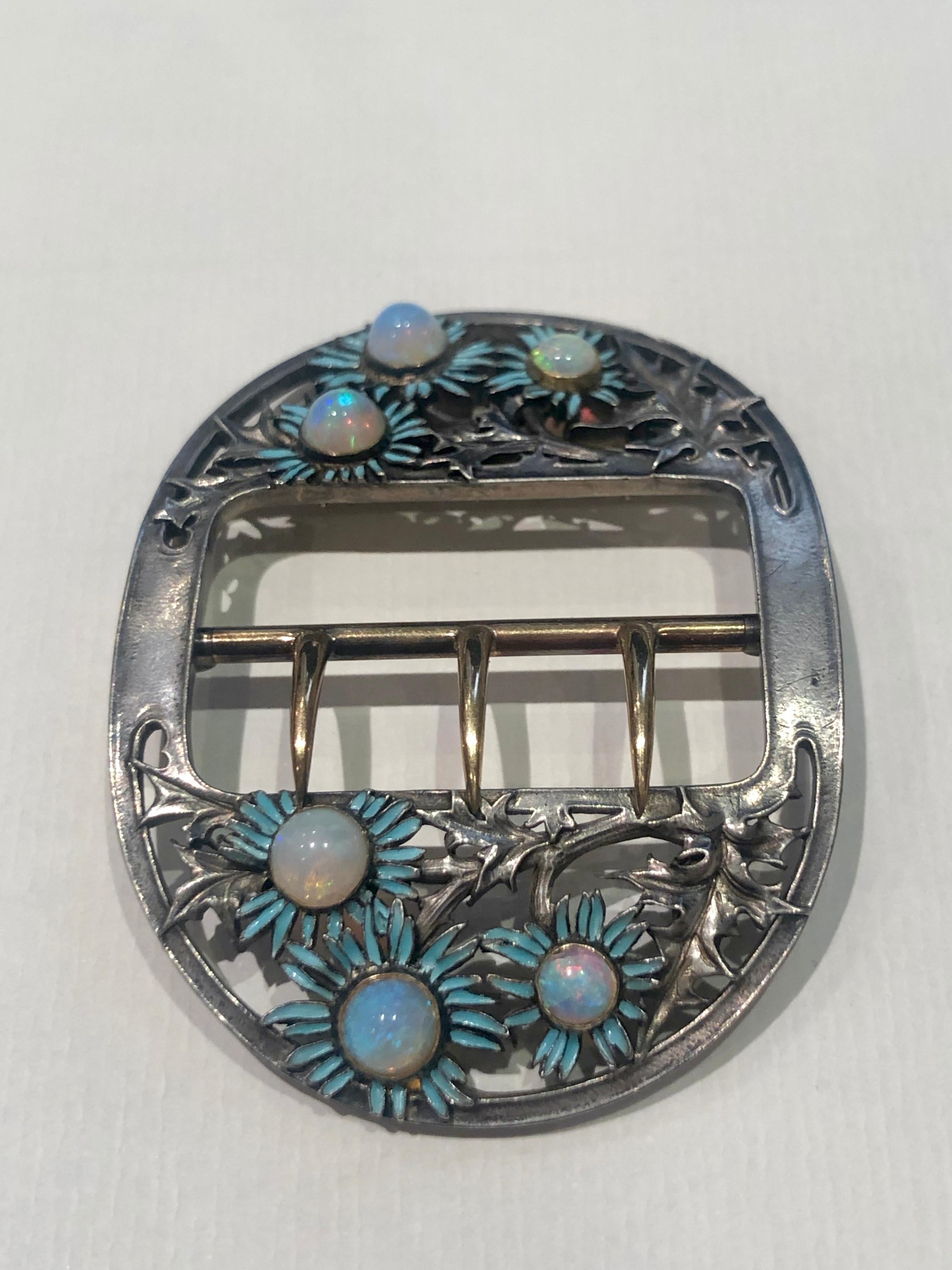 Unique Blue Daisies buckle by René Lalique circa 1890. 

Buckle is made with silver, yellow gold and six opal stones in center of blue enamel daisies. 

All parts of the buckle are original. No restoration at all. 