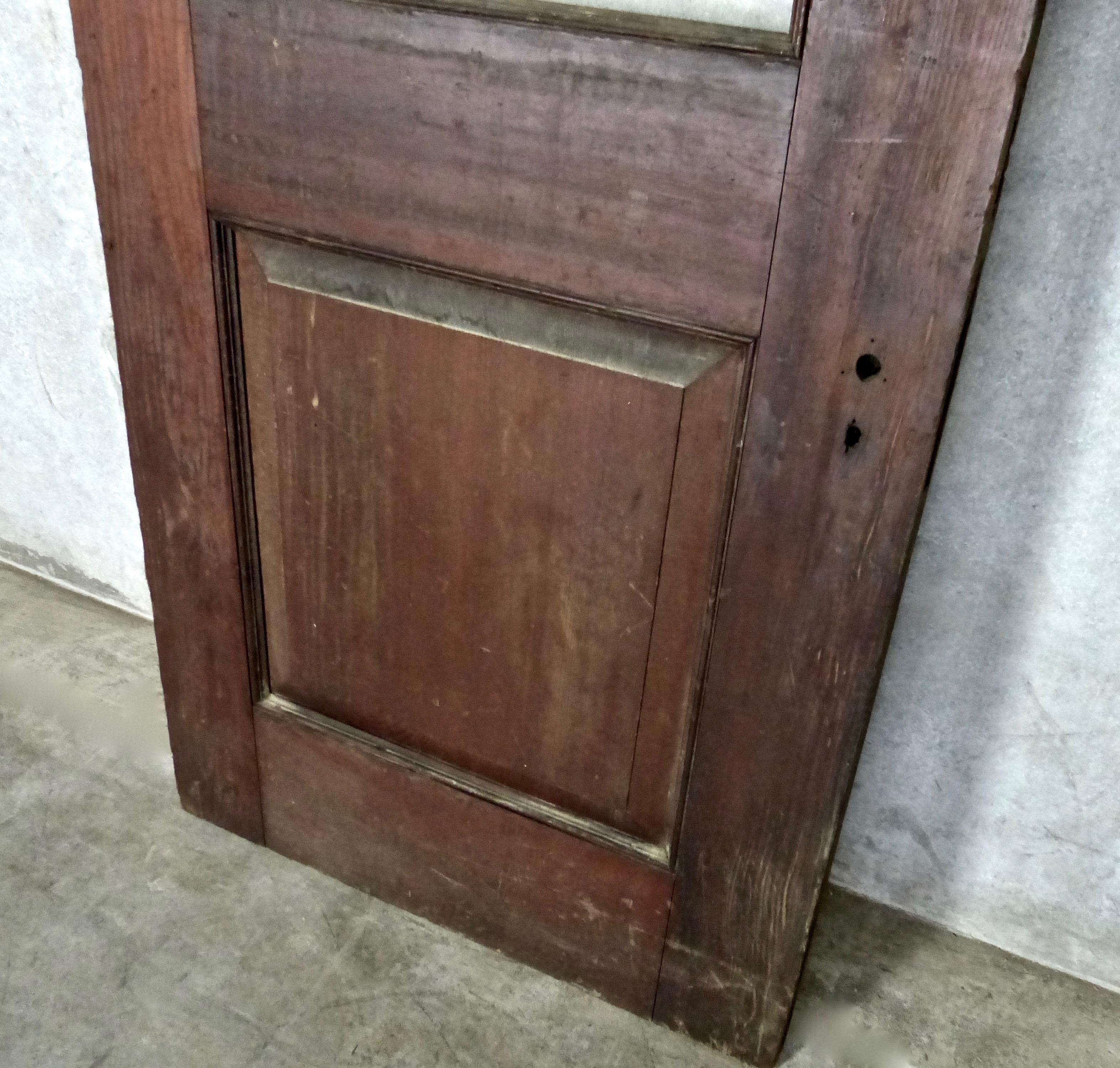 Selection of five solid fir, raised single panel wooden doors. Original suite numbers on upper panel. Original finish; awaiting your choice of glass. High quality architectural salvage from the 1890s.
Dimensions: 89