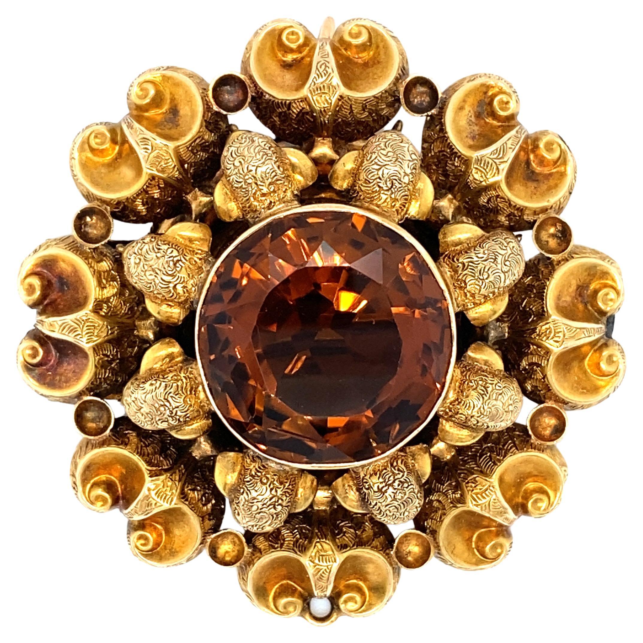 Circa 1890s 20.0 carat Citrine and Eight Ram Head Brooch in 15 Karat Gold  For Sale