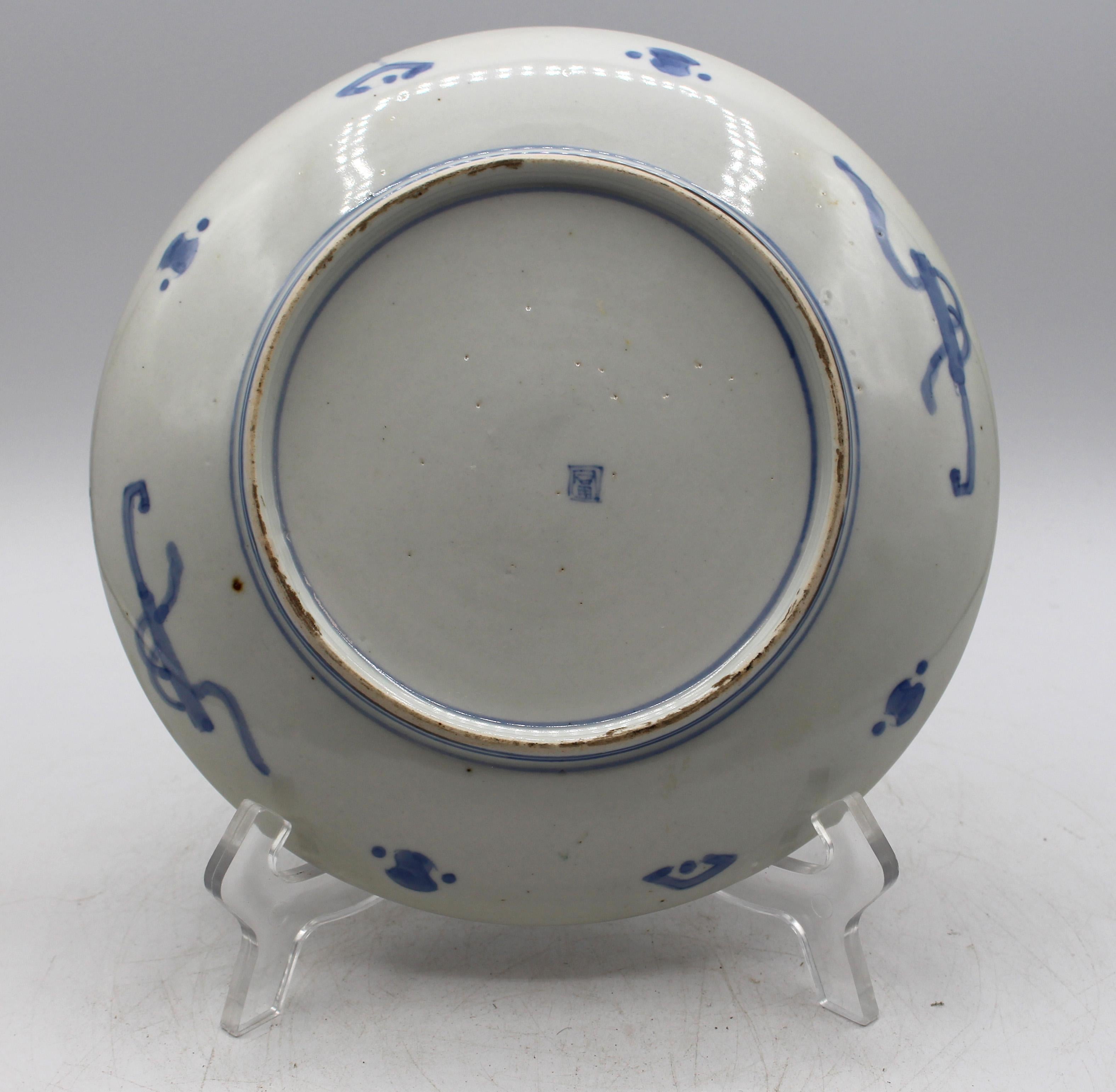 Circa 1890s signed Imari plate, Japanese. With reserves of white pine trees with their colorful Spring cones alternating with burnt orange cartouches with naturalistic motif.
8 7/16
