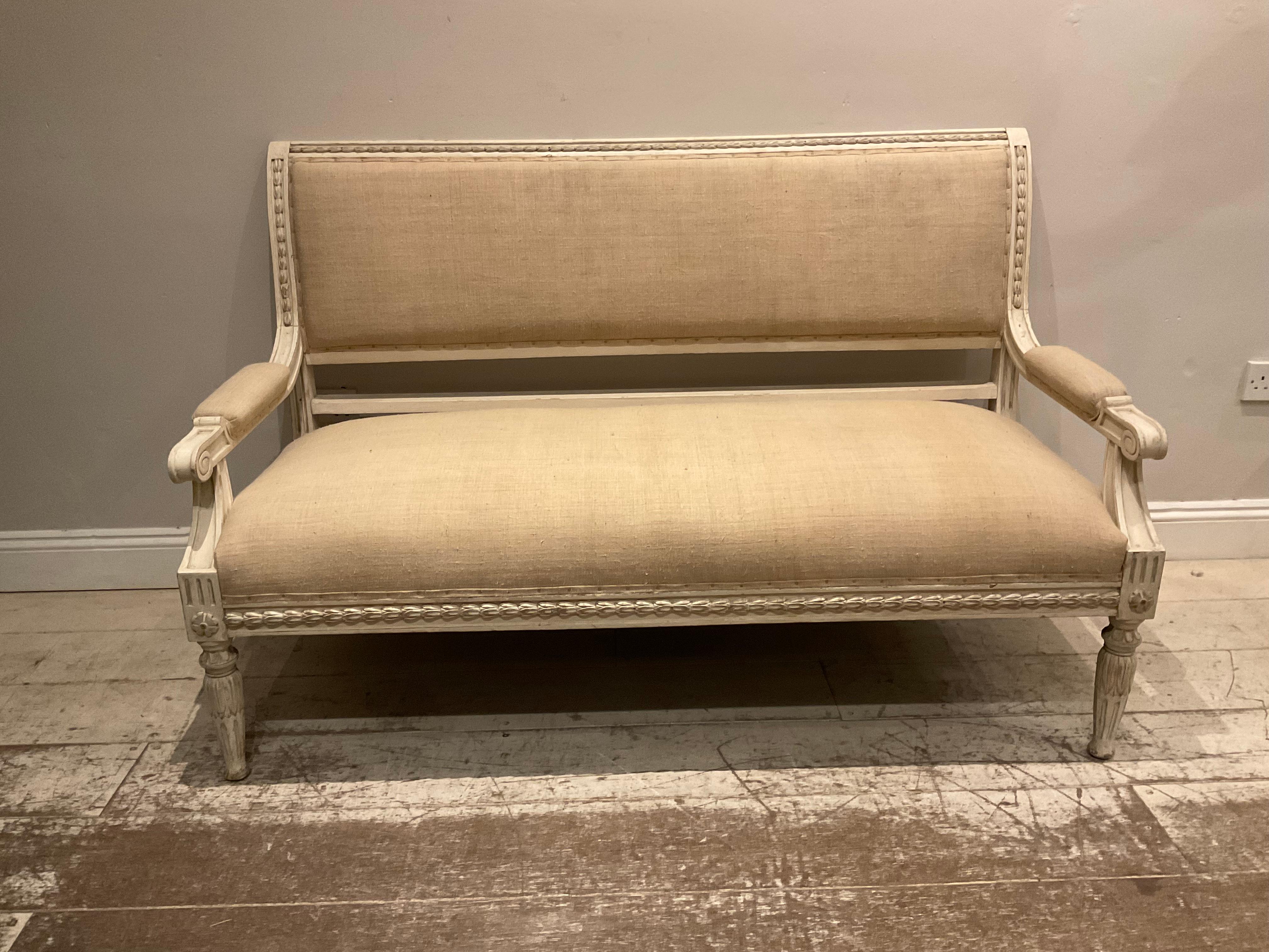 A good size and comfortable Swedish sofa in the Gustavian style. Circa 1890.
The paint has been hand scraped and refreshed.
It has a frieze of applied plaster leaf detailing and rounders at the the front.
The sofa has been upholstered in a lovely