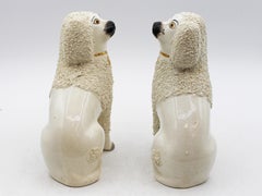Circa 1891-1911 English Pair of Staffordshire Ceramic Poodle Dogs