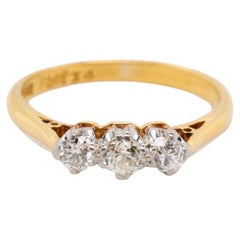 Circa 1900 Antique Edwardian Platinum 18K Yellow Gold Three Stone Diamond Ring