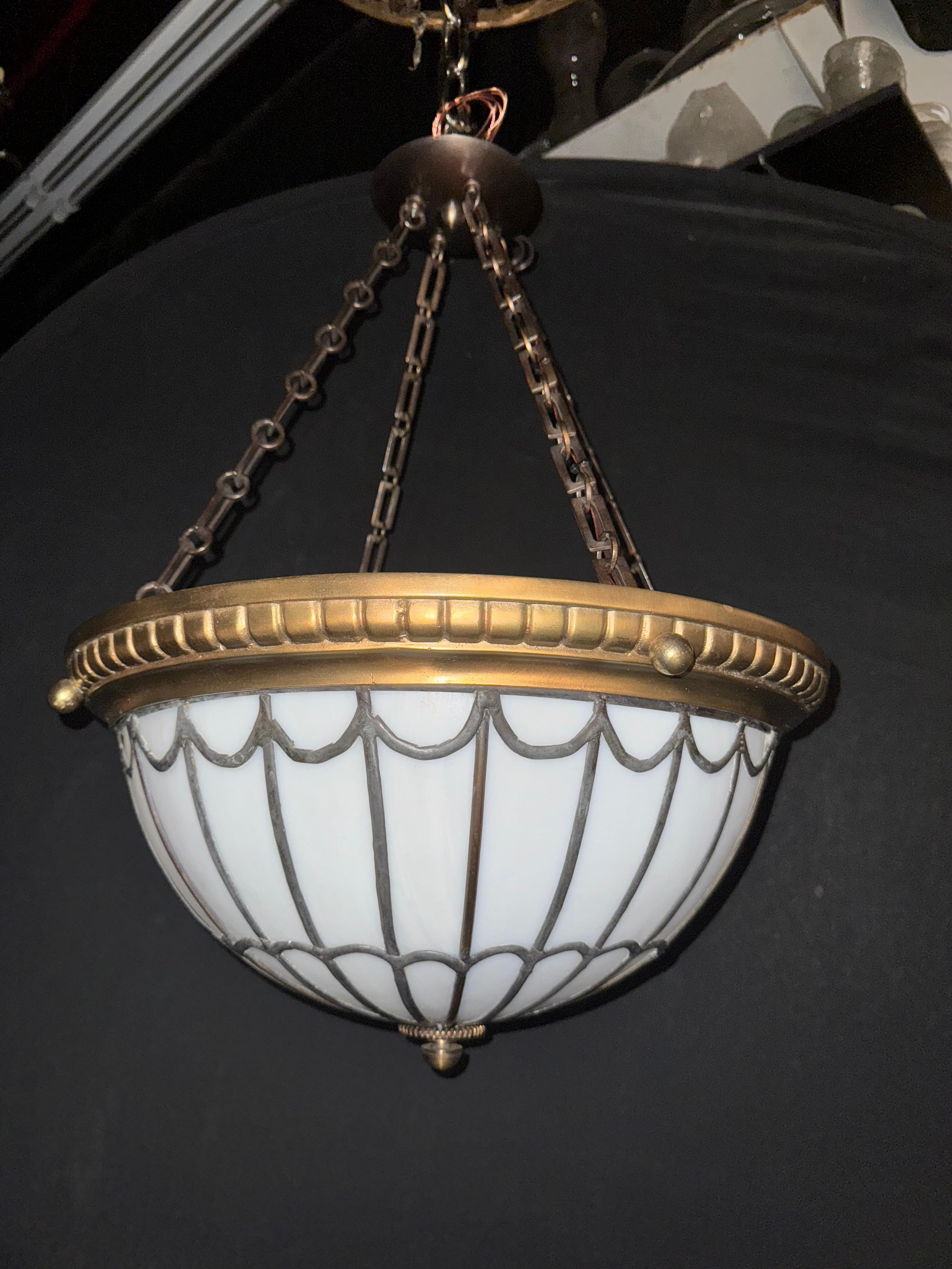 1900 Caldwell leaded glass hanging light fixture with interior lights. great condition.