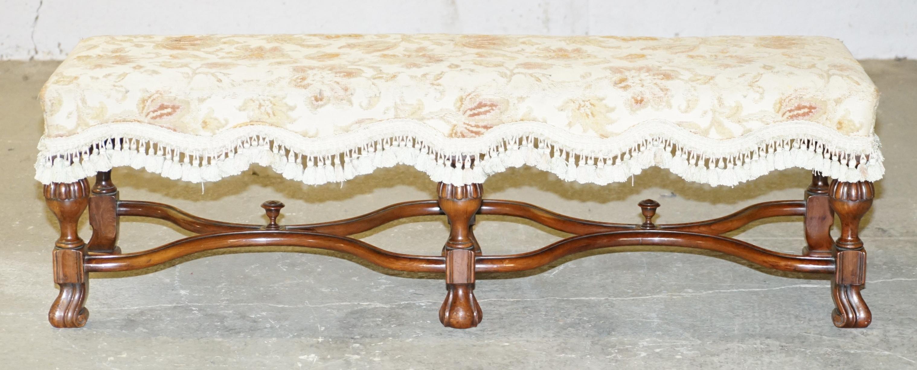 We are delighted to this lovely circa 1900 William & Mary style long two person footstool bench

A very decorative stool, ideally suited for two people to share, the timber frame is a real tour de force or antique English style and design

We
