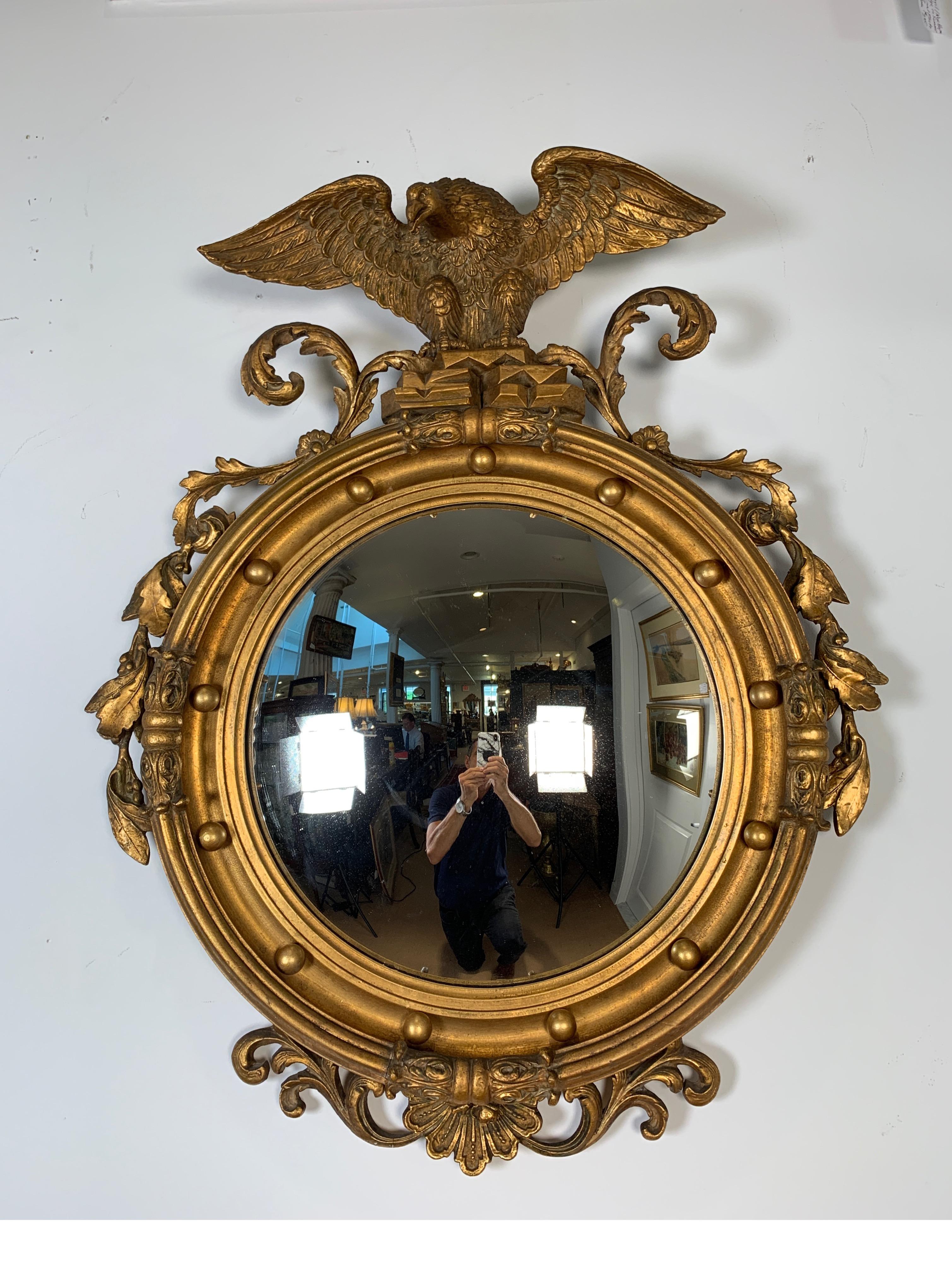 Federal style carved gilt bullseye mirror w/ american eagle on crest, circa 1900.
Nicely carved and gesso gilt mirror with great details. Great for library, office.
Dimensions: 36