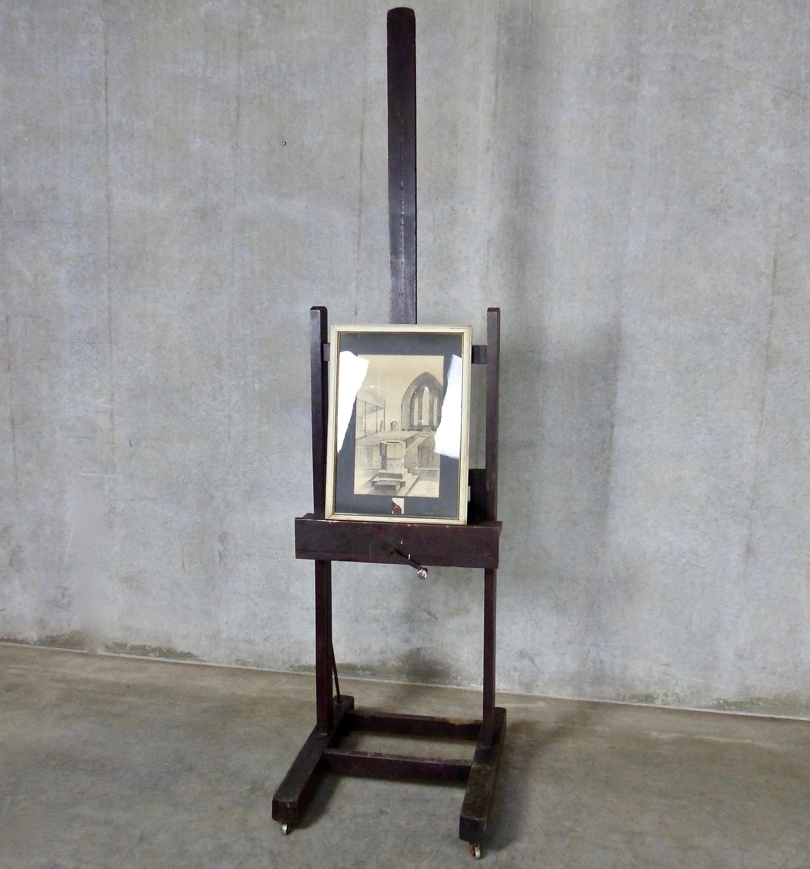 A freestanding, large artist’s easel on wheels, circa 1900, France. Original finish on solid walnut so very sturdy. Fully adjustable with a hand crank; some brass hardware. Display your best painting, or less conventionally, try a flat screen