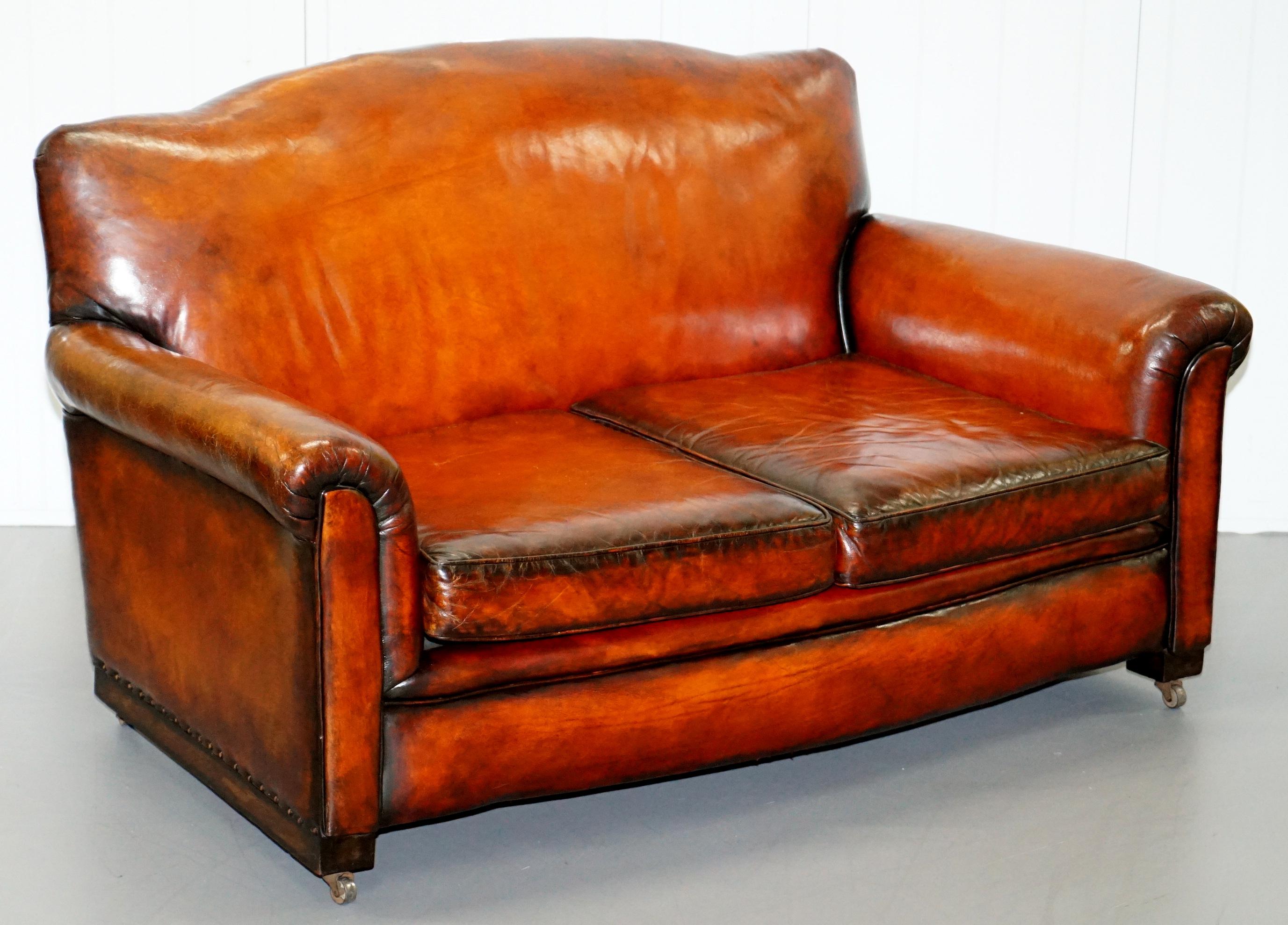 We are delighted to this stunning original circa 1900 fully restored hand dyed whisky brown leather sofa and armchairs suite

A stunning set that has been restored to a very high standard indeed. The suite has been upholstered with natural fully