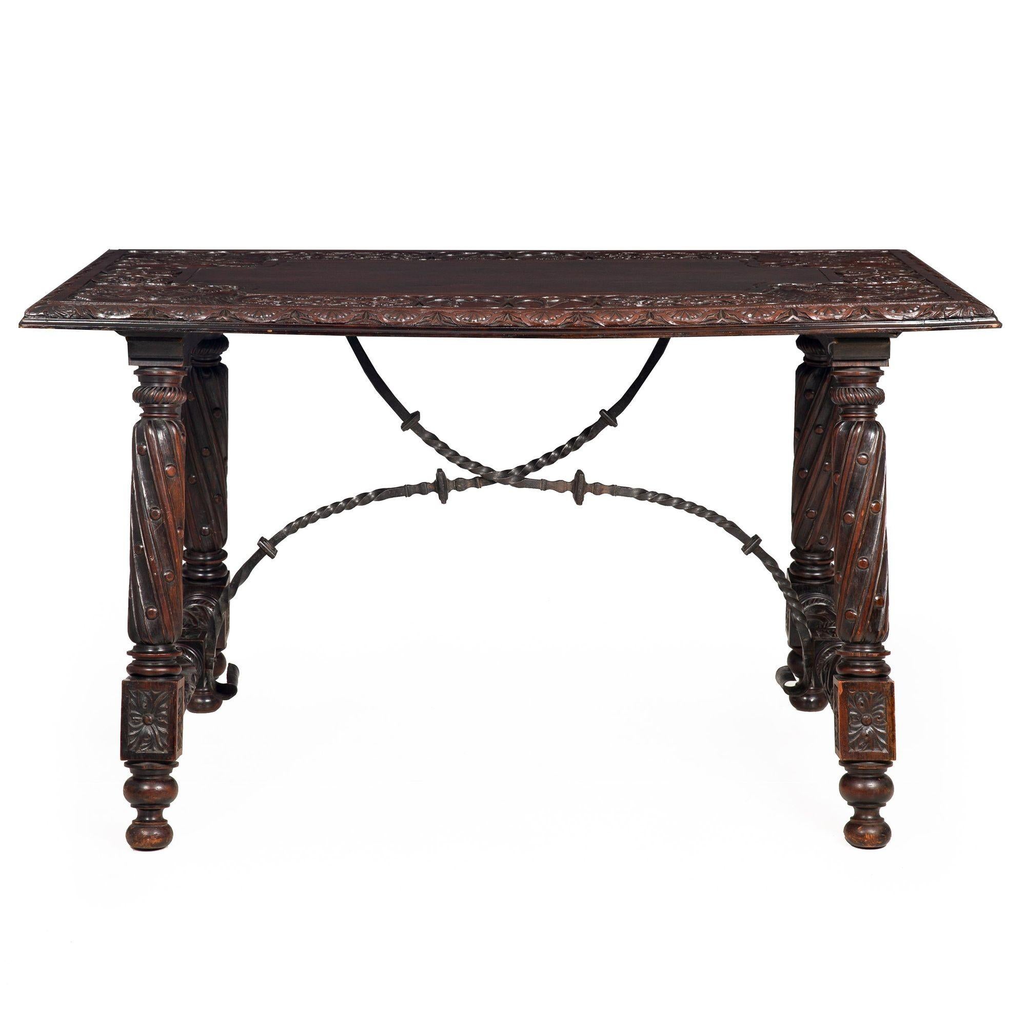 GOTHIC REVIVAL CARVED WALNUT LIBRARY TABLE WITH HERALDIC MOTIF
Europe, circa 1900
Item # 309AKJ22Q

A rich and beautifully made library table, the entire form is designed around the older Gothic table top. This is a richly patinated surface crafted